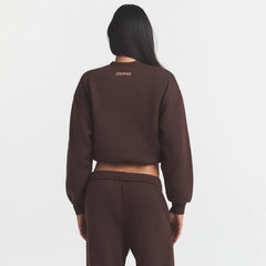 COTTON FLEECE BOMBER | ESPRESSO ON A MODEL SIDE VIEW @ | FOCUS: 0.0, 1.0, 0.9