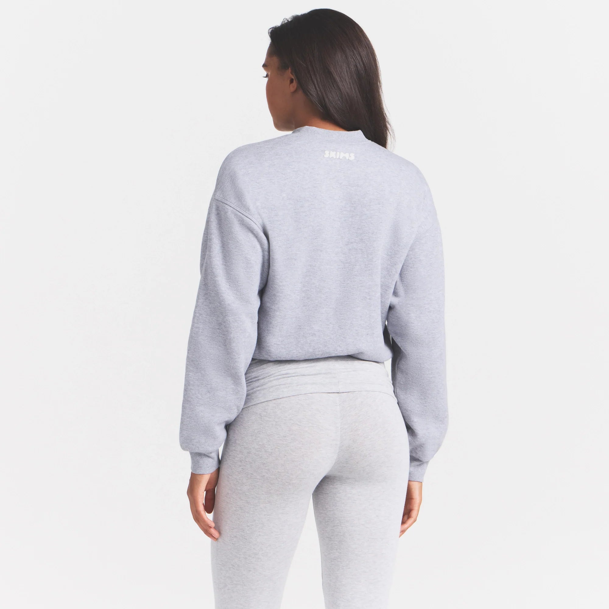 COTTON FLEECE BOMBER | HEATHER GREY ON A MODEL SIDE VIEW @ | FOCUS: 0.0, 1.0, 0.9