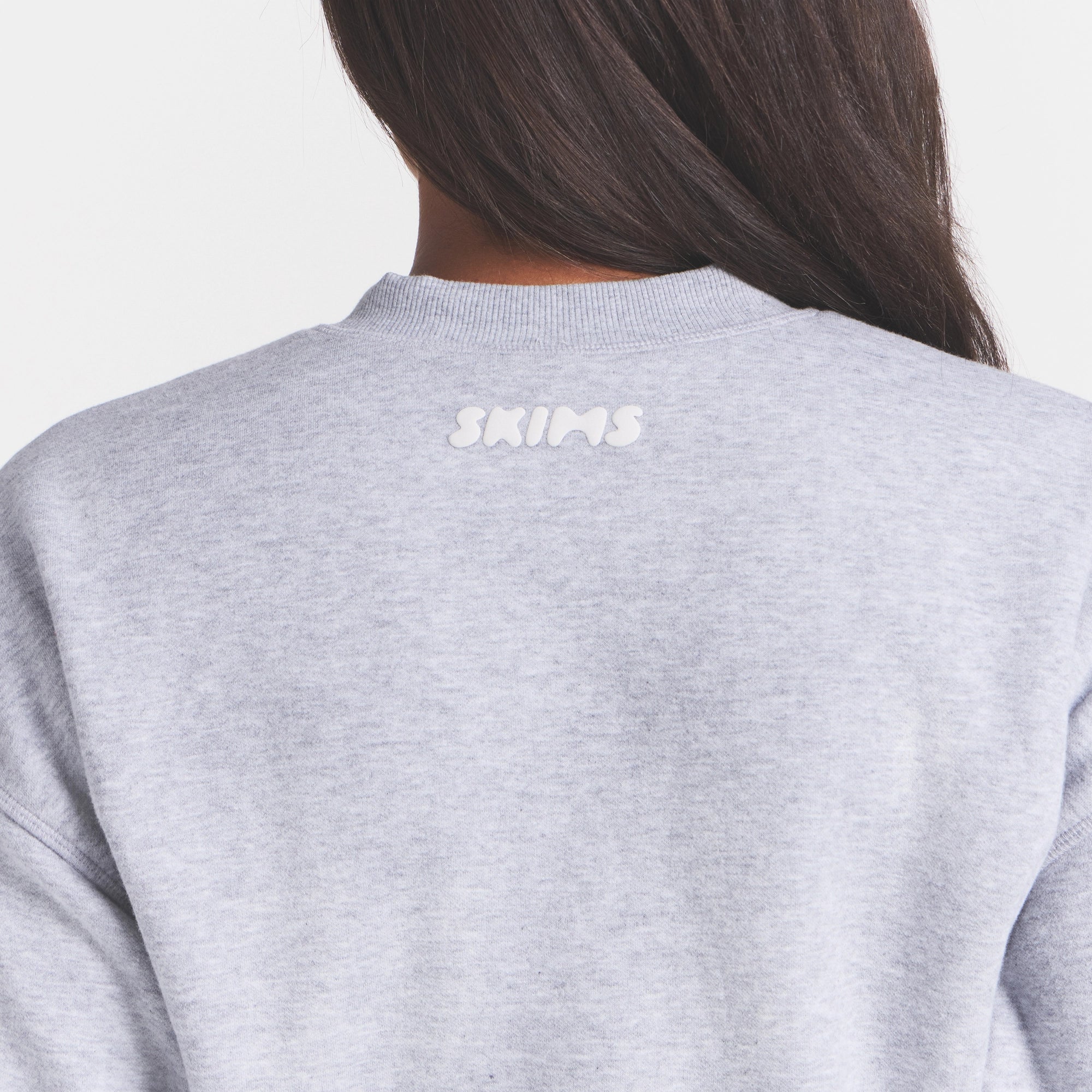 COTTON FLEECE BOMBER | HEATHER GREY ON A MODEL SIDE VIEW @ | FOCUS: 0.0, 1.0, 0.9