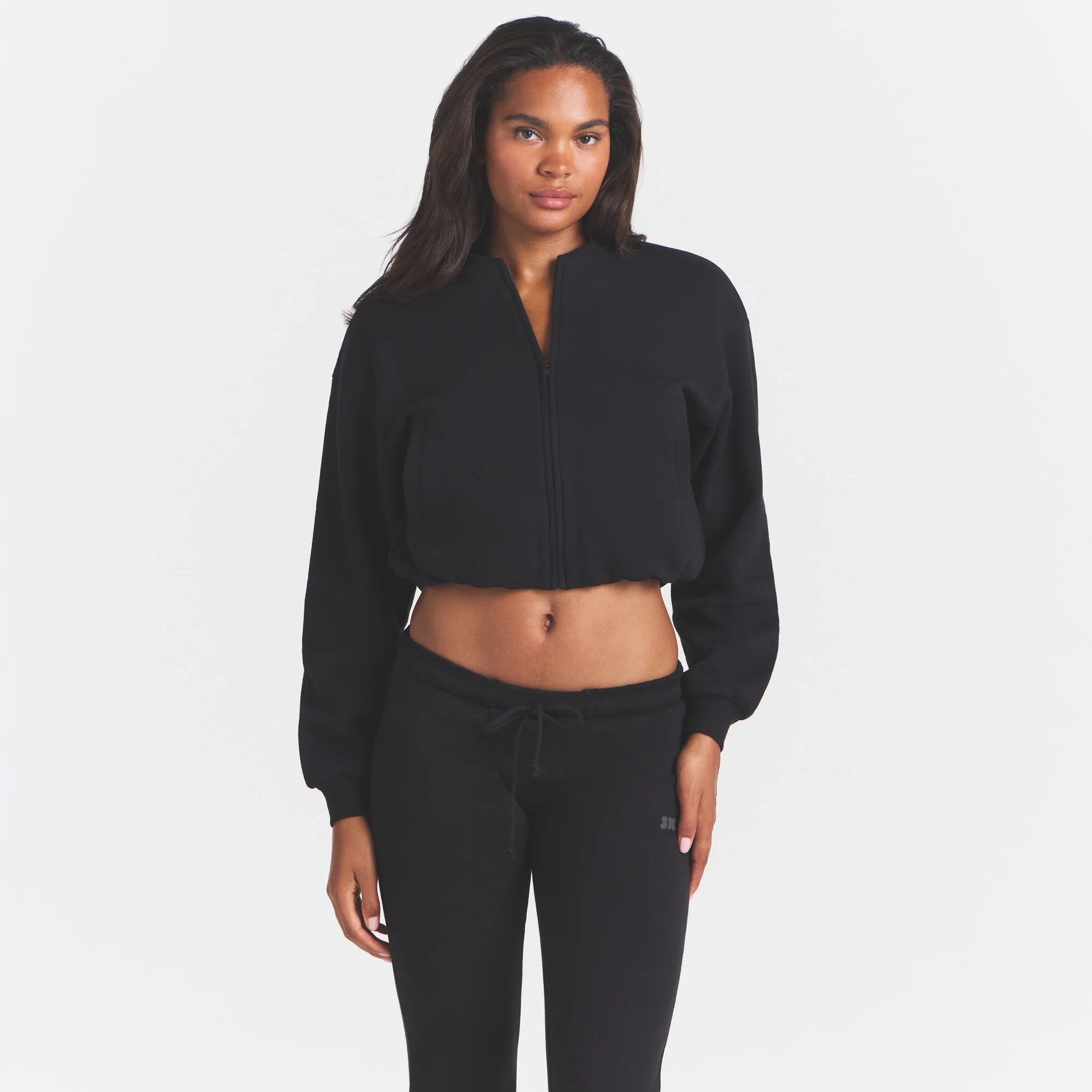 COTTON FLEECE BOMBER | ONYX ON A MODEL SIDE VIEW @ | FOCUS: 0.0, 1.0, 0.9