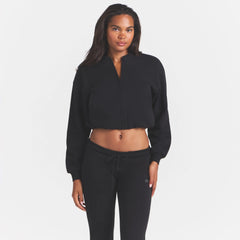 COTTON FLEECE BOMBER | ONYX ON A MODEL SIDE VIEW @ | FOCUS: 0.0, 1.0, 0.9