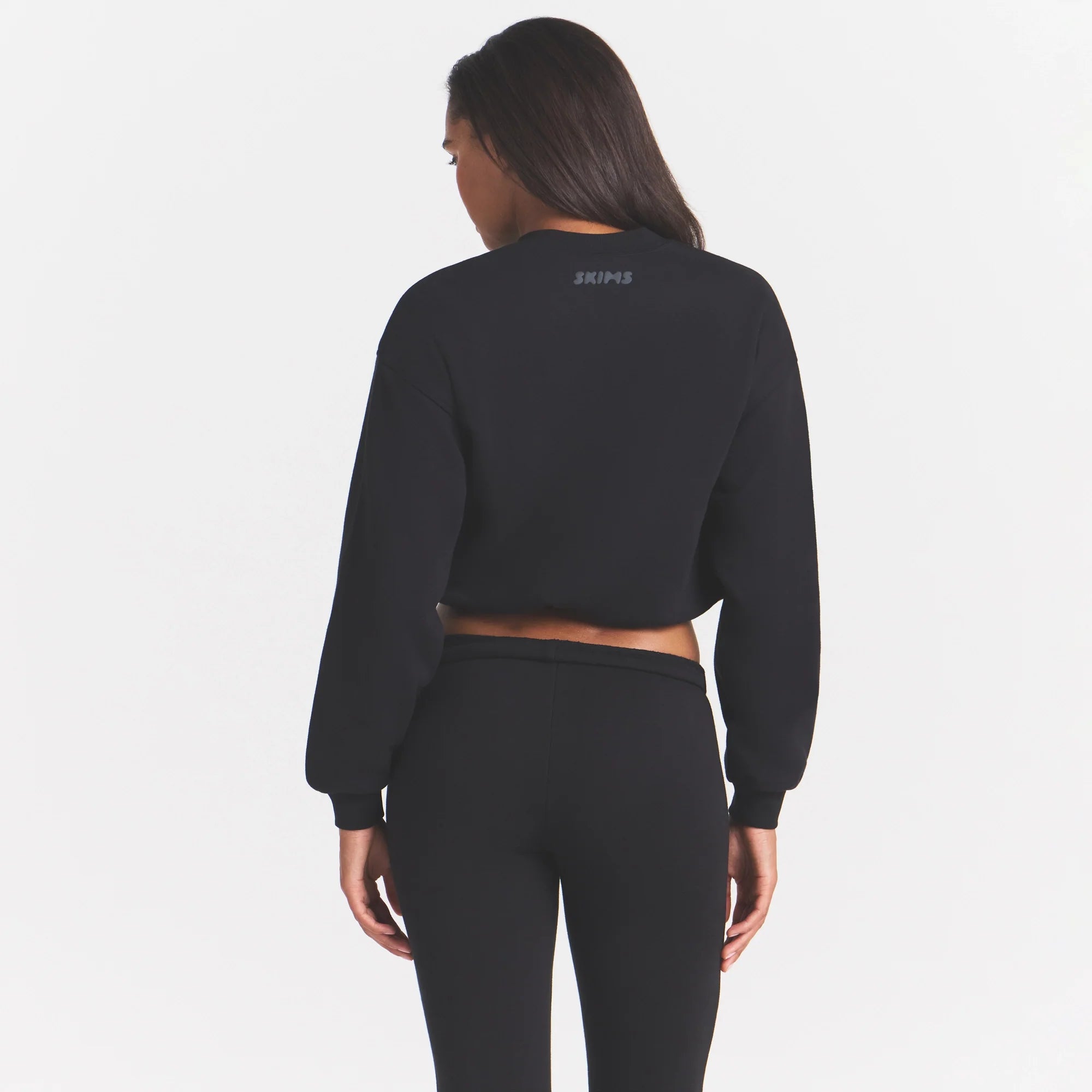 COTTON FLEECE BOMBER | ONYX ON A MODEL SIDE VIEW @ | FOCUS: 0.0, 1.0, 0.9