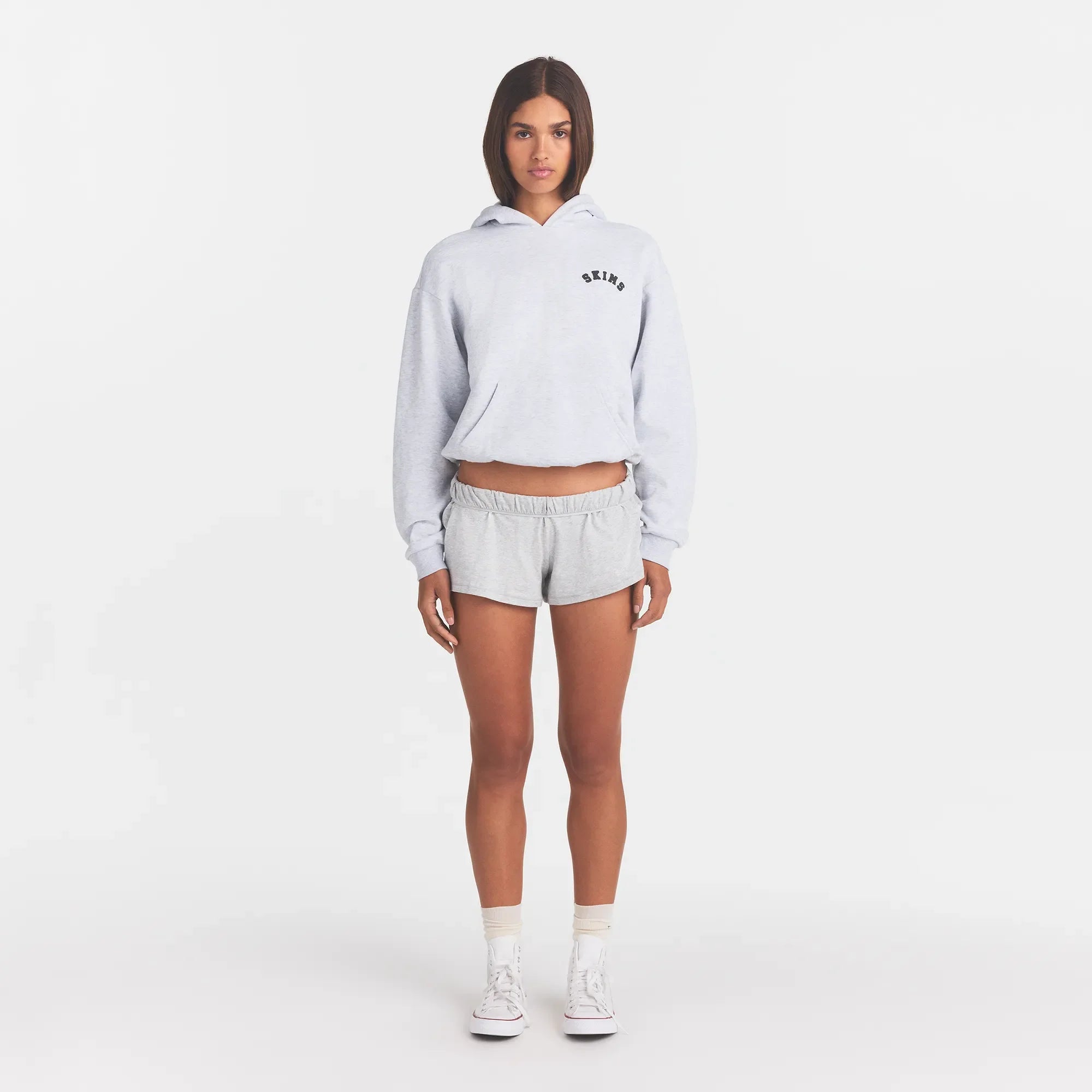COTTON FLEECE CLASSIC HOODIE | LIGHT HEATHER GREY WITH ONYX LOGO ON A MODEL FRONT VIEW @ | FOCUS: 0.0, 1.0, 0.9