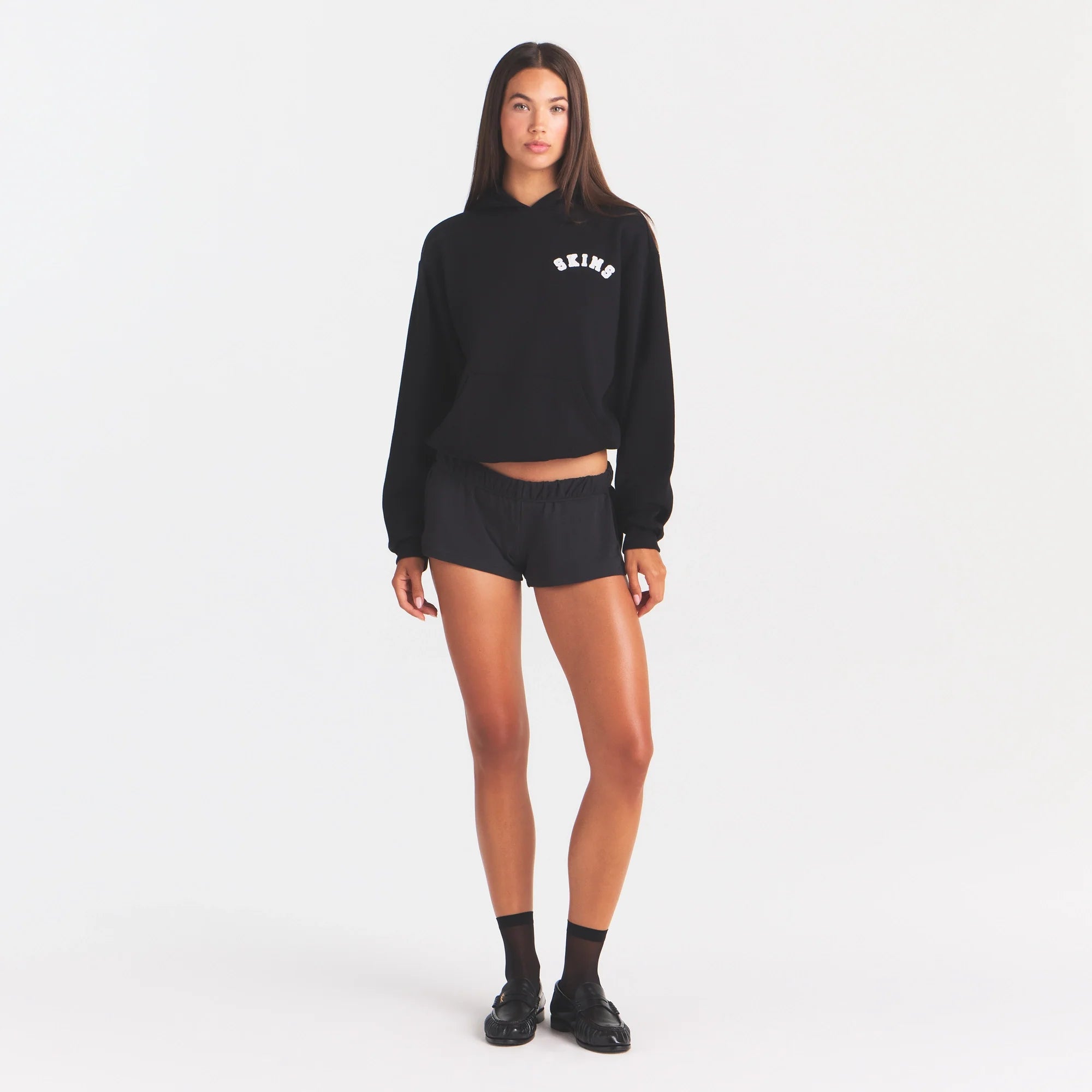 COTTON FLEECE CLASSIC HOODIE | ONYX SNOW ARCHED SKIMS LOGO ON A MODEL | FLT@ | FOCUS: 0.0, 1.0, 0.9
