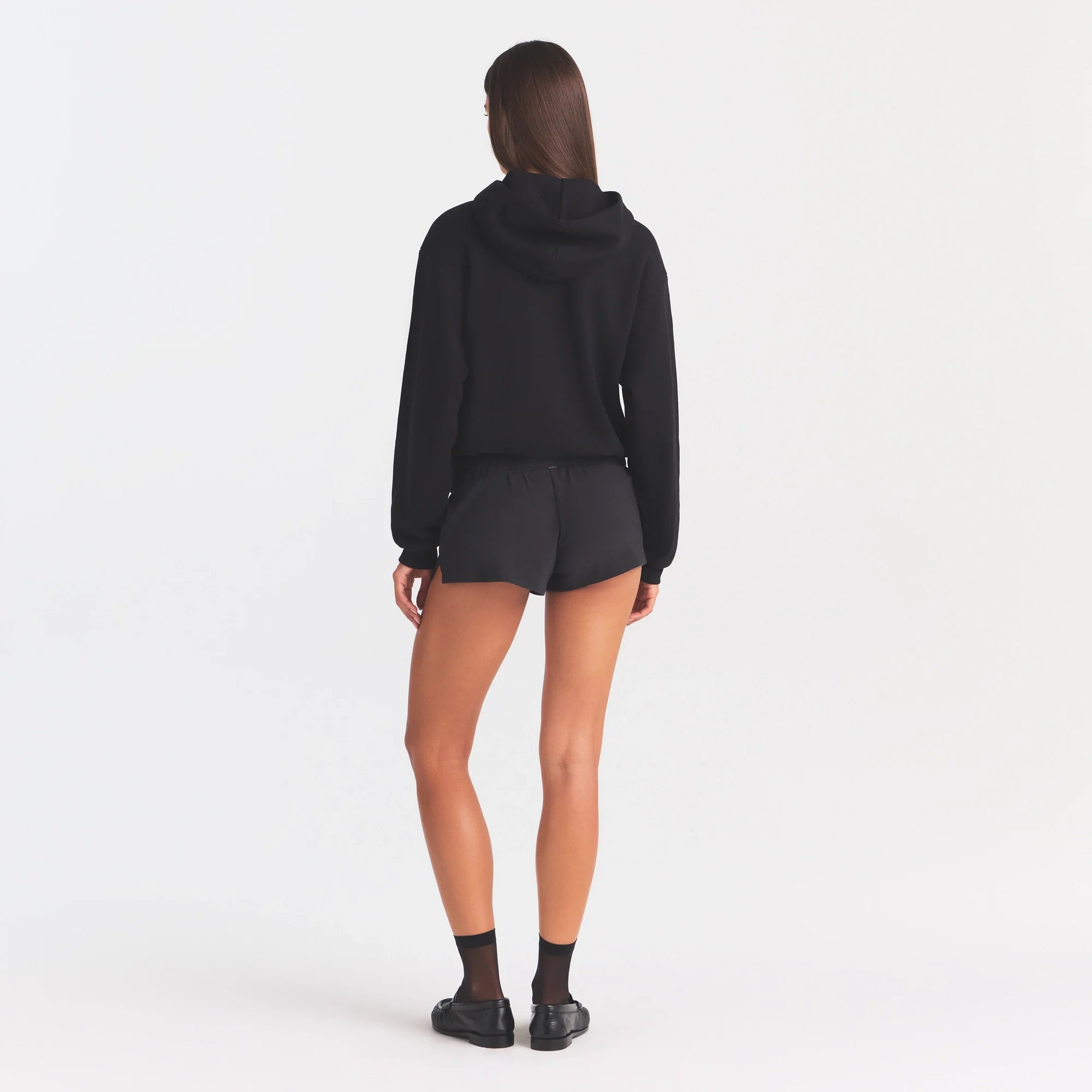 COTTON FLEECE CLASSIC HOODIE | ONYX SNOW ARCHED SKIMS LOGO ON A MODEL | FLT@ | FOCUS: 0.0, 1.0, 0.9