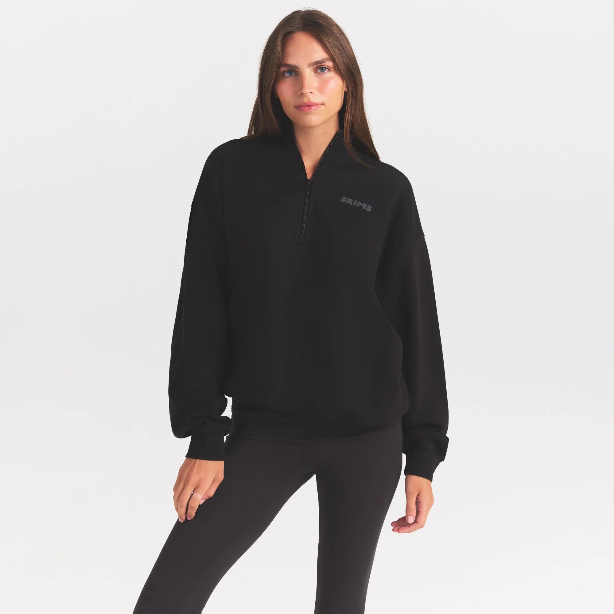 COTTON FLEECE MOCK NECK QUARTER ZIP WITH EMBOSSED LOGO | ONYX ON A MODEL SIDE VIEW @ | FOCUS: 0.0, 1.0, 0.9