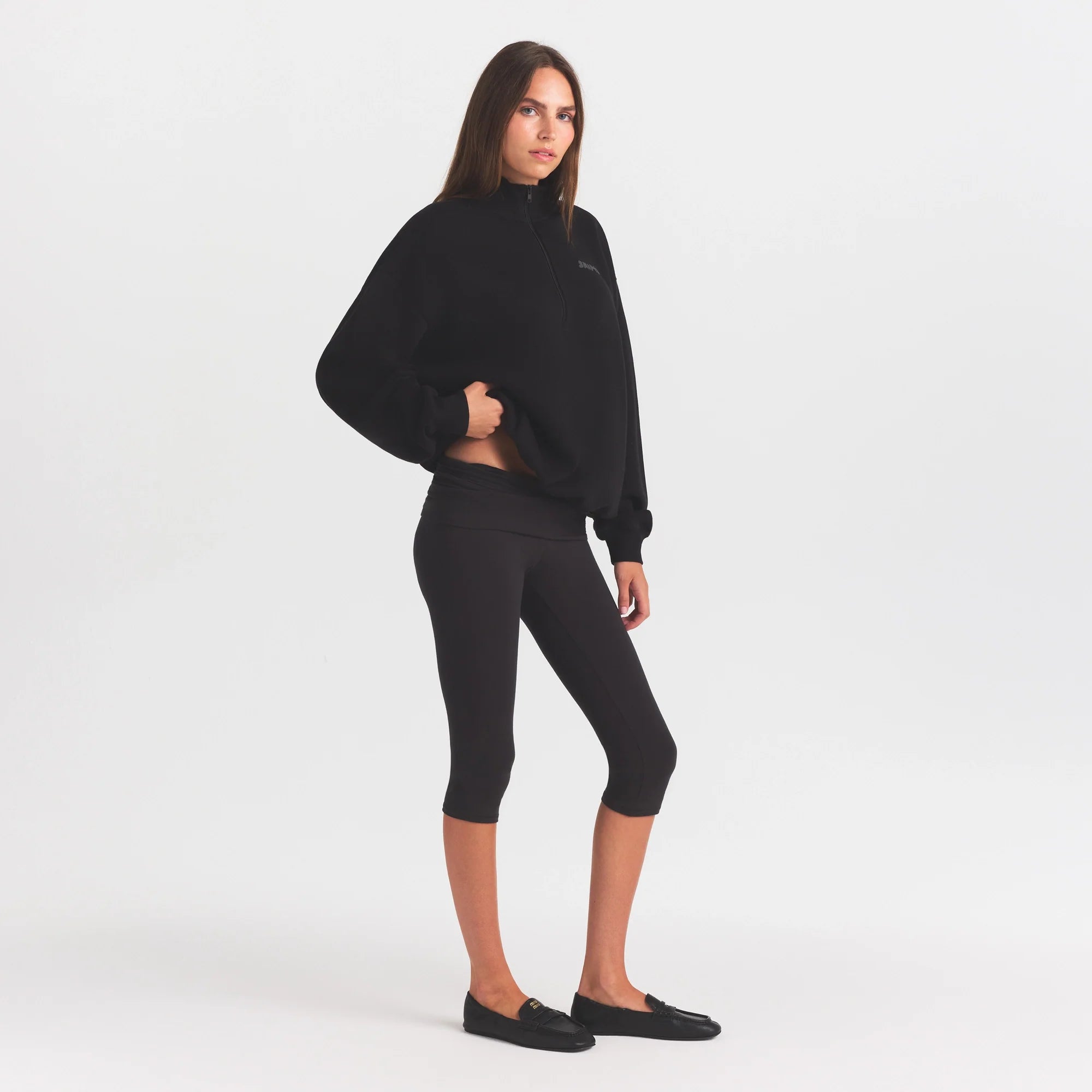 COTTON FLEECE MOCK NECK QUARTER ZIP WITH EMBOSSED LOGO | ONYX ON A MODEL FRONT VIEW @ | FOCUS: 0.0, 1.0, 0.9