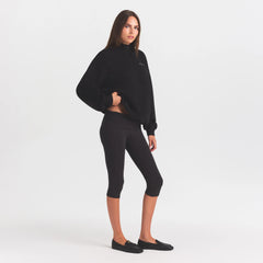 COTTON FLEECE MOCK NECK QUARTER ZIP WITH EMBOSSED LOGO | ONYX ON A MODEL FRONT VIEW @ | FOCUS: 0.0, 1.0, 0.9