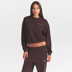 COTTON FLEECE CREWNECK WITH EMBOSSED LOGO | ESPRESSO & LAYS FLAT ON A WHITE BACKGROUND | FLT @ | FOCUS: 0.0, 1.0, 0.9