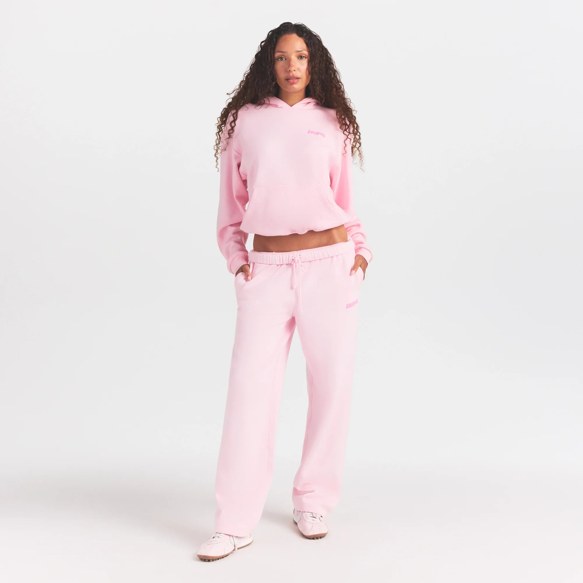 COTTON FLEECE HOODIE WITH EMBOSSED LOGO | CHERRY BLOSSOM ON A MODEL FRONT VIEW @ | FOCUS: 0.0, 1.0, 0.9