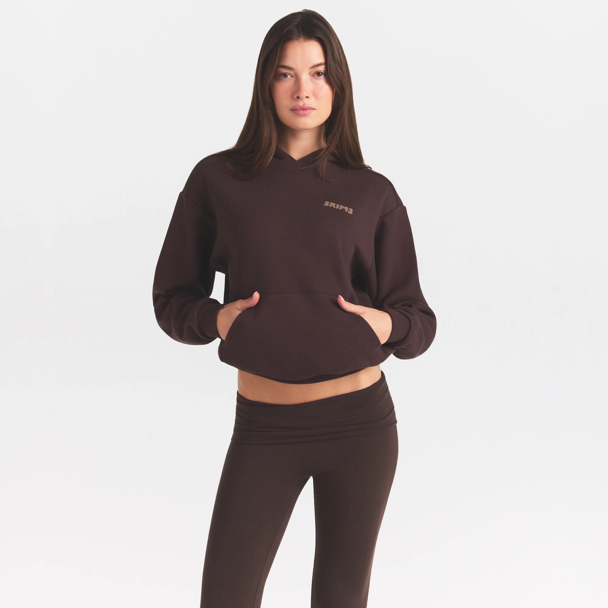 COTTON FLEECE HOODIE WITH EMBOSSED LOGO | ESPRESSO ON A MODEL SIDE VIEW @ | FOCUS: 0.0, 1.0, 0.9
