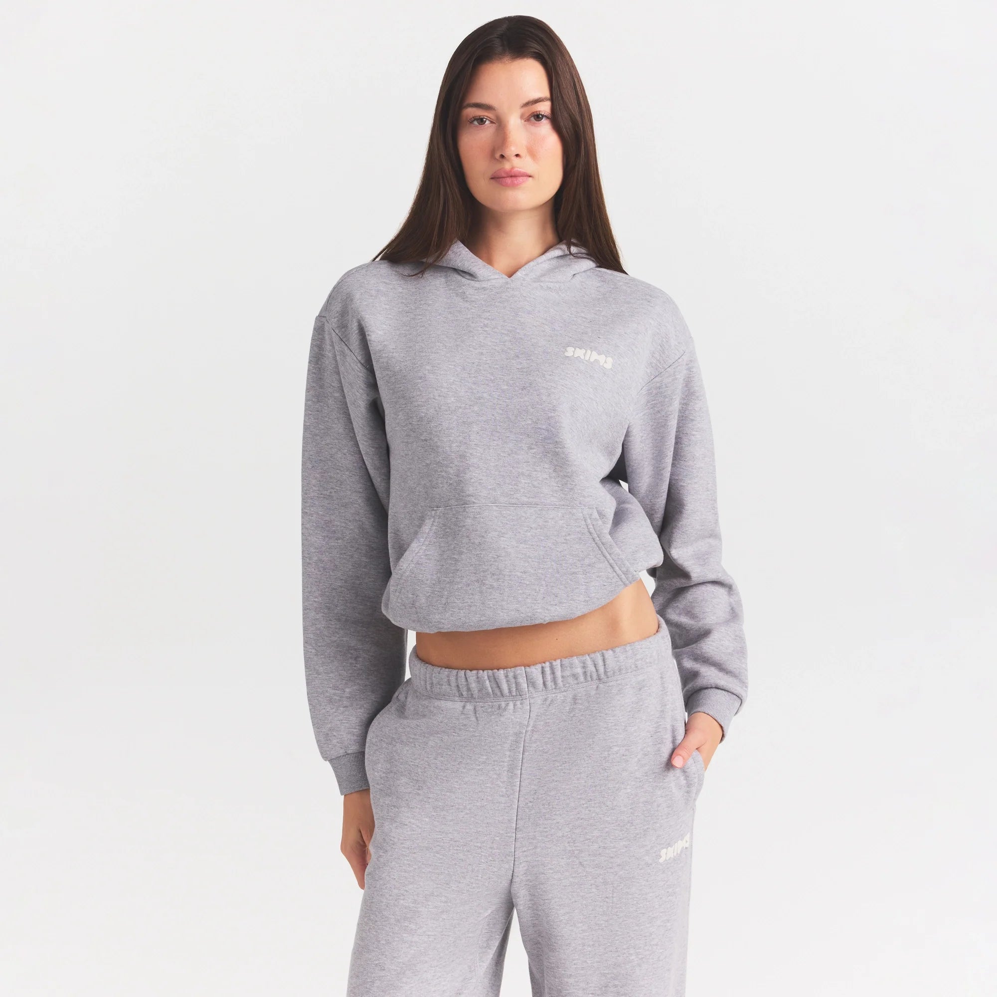 COTTON FLEECE CLASSIC HOODIE | HEATHER GREY ON A MODEL SIDE VIEW @ | FOCUS: 0.0, 1.0, 0.9