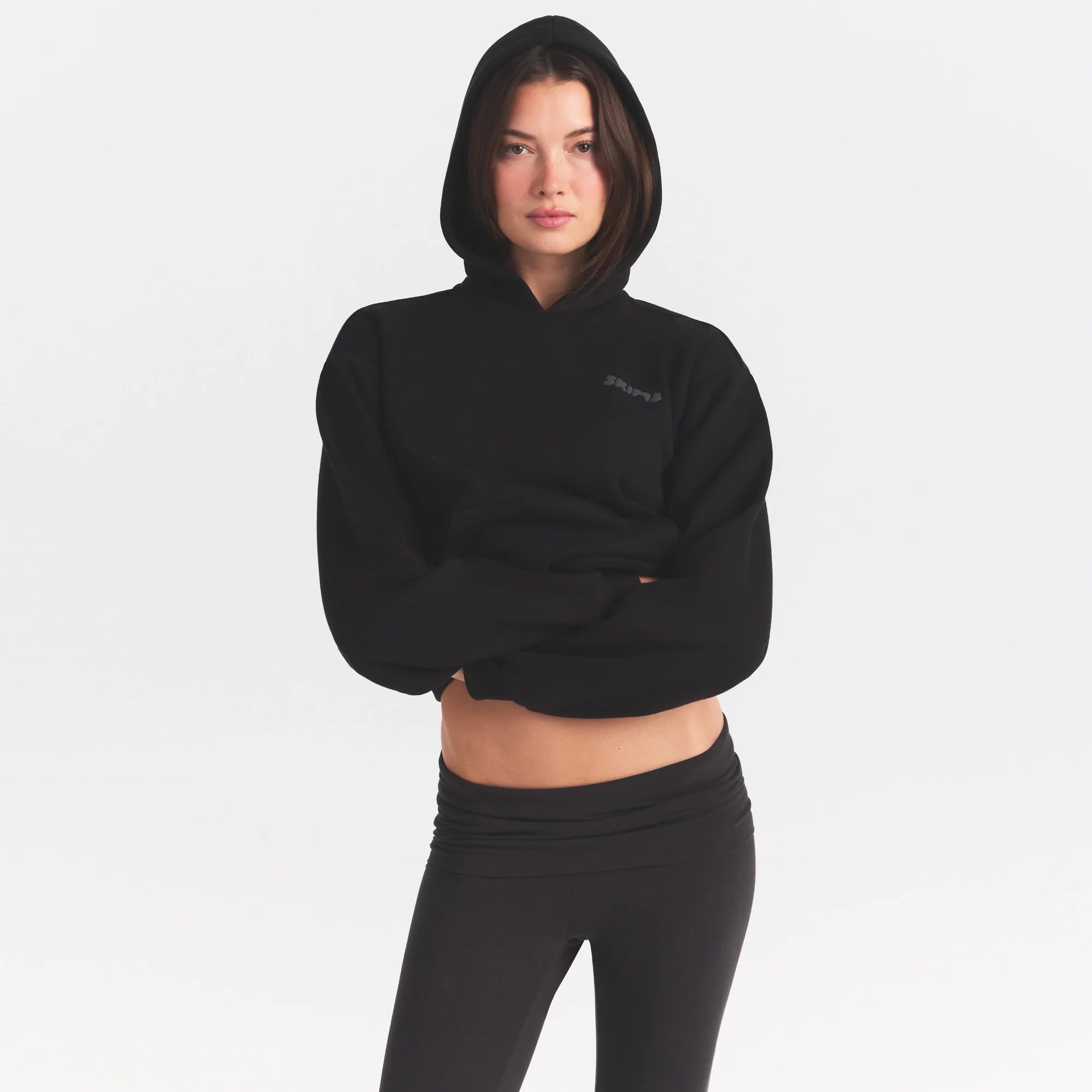 COTTON FLEECE HOODIE WITH EMBOSSED LOGO | ONYX ON A MODEL SIDE VIEW @ | FOCUS: 0.0, 1.0, 0.9