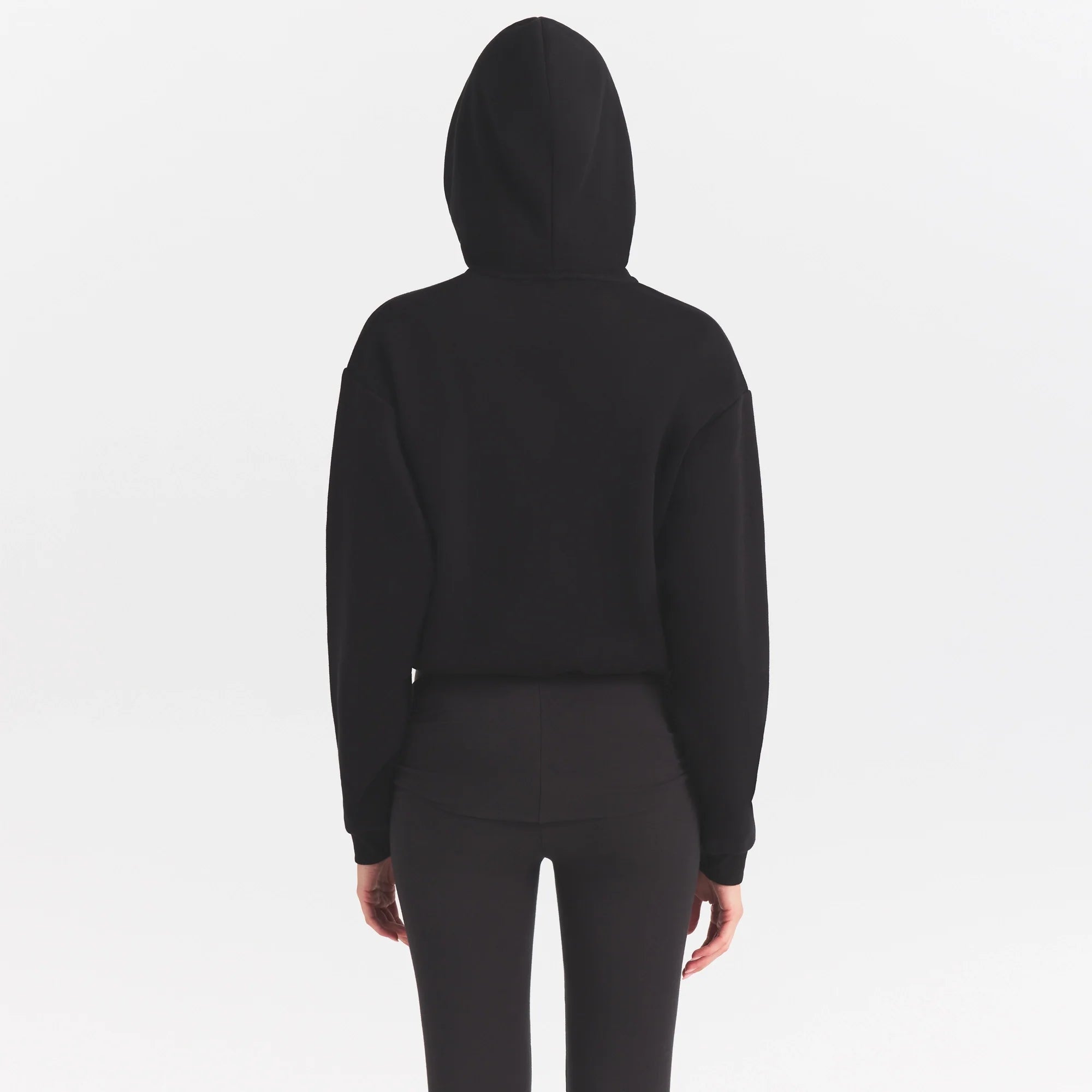 COTTON FLEECE HOODIE WITH EMBOSSED LOGO | ONYX ON A MODEL SIDE VIEW @ | FOCUS: 0.0, 1.0, 0.9