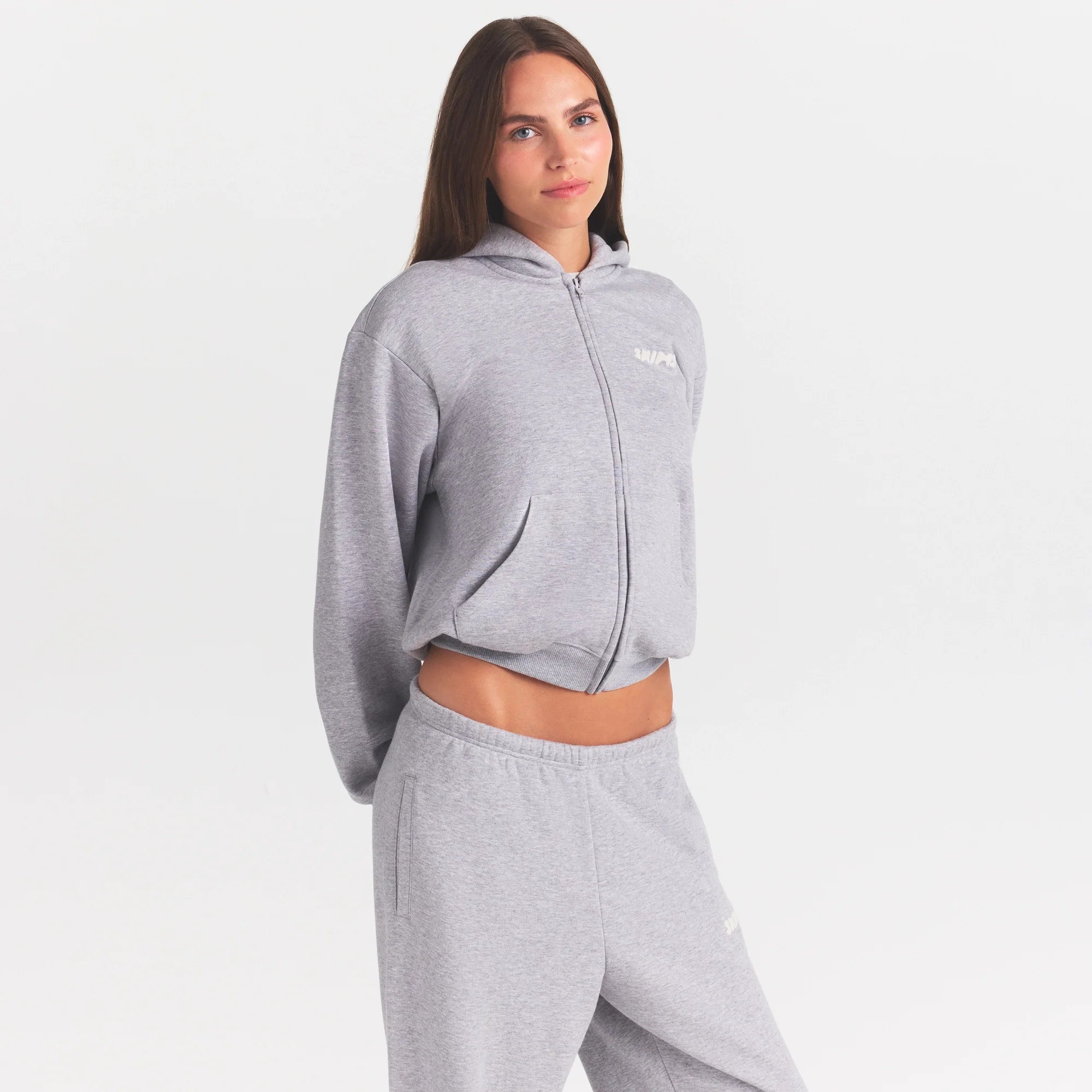 COTTON FLEECE STRAIGHT LEG PANT WITH EMBOSSED LOGO | HEATHER GREY & LAYS FLAT ON A WHITE BACKGROUND | FLT