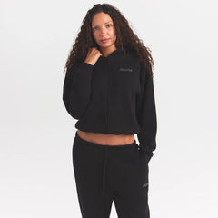 COTTON FLEECE ZIP UP HOODIE WITH EMBOSSED LOGO | ONYX ON A MODEL SIDE VIEW @ | FOCUS: 0.0, 1.0, 0.9