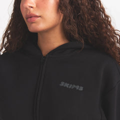 COTTON FLEECE ZIP UP HOODIE WITH EMBOSSED LOGO | ONYX ON A MODEL SIDE VIEW @ | FOCUS: 0.0, 1.0, 0.9