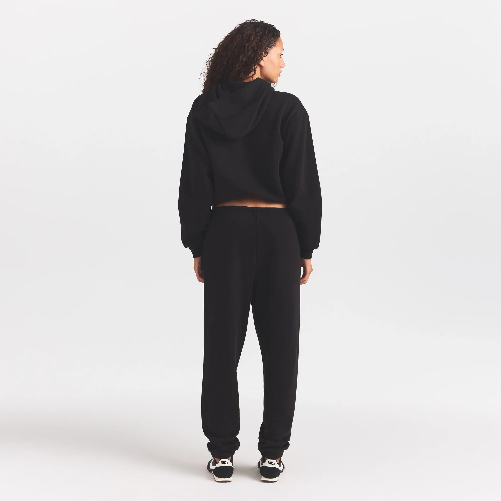 COTTON FLEECE ZIP UP HOODIE WITH EMBOSSED LOGO | ONYX ON A MODEL FRONT VIEW @ | FOCUS: 0.0, 1.0, 0.9