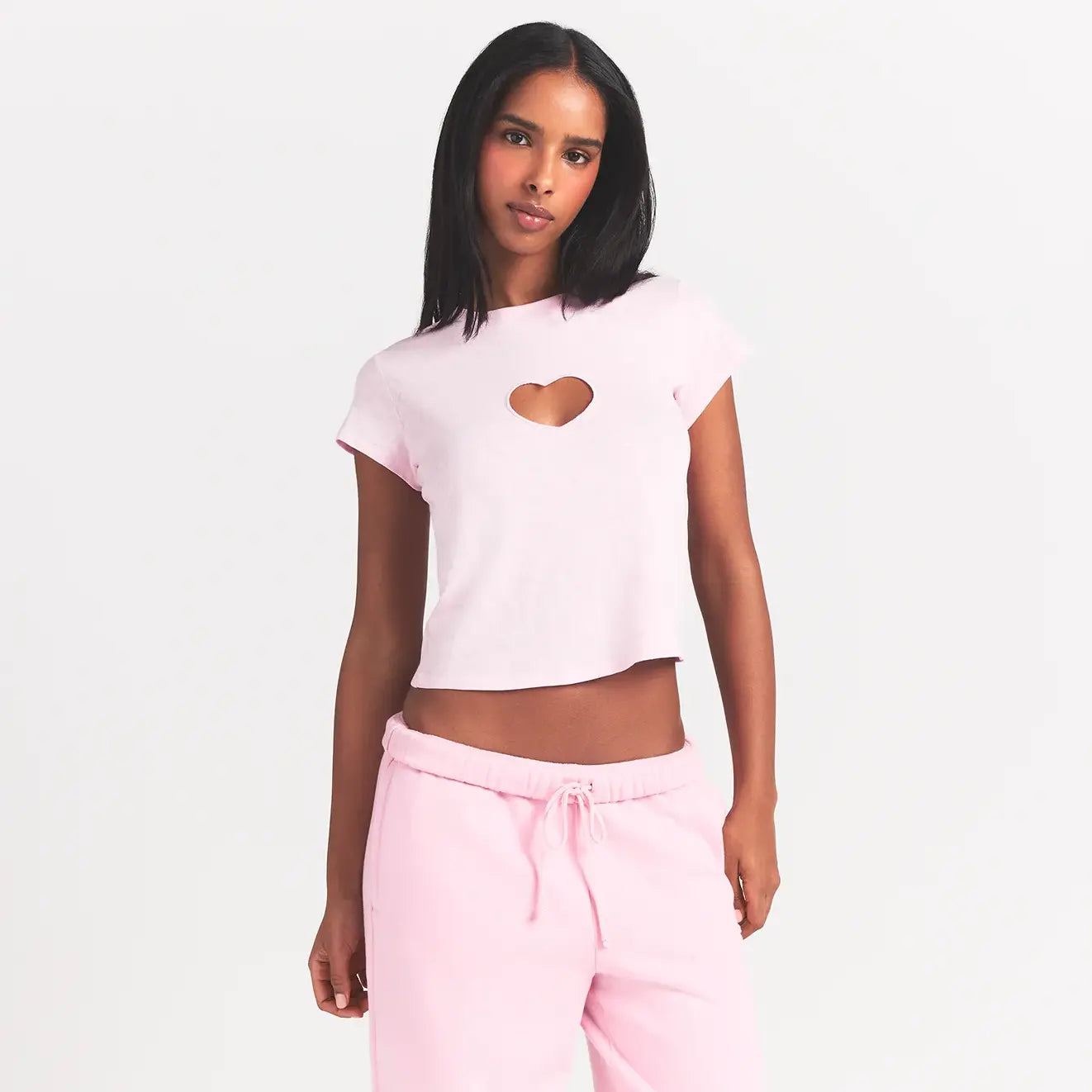 WORN IN JERSEY BABY HEART T-SHIRT | BABY PINK ON A MODEL FRONT VIEW @ | FOCUS: 0.0, 1.0, 0.9