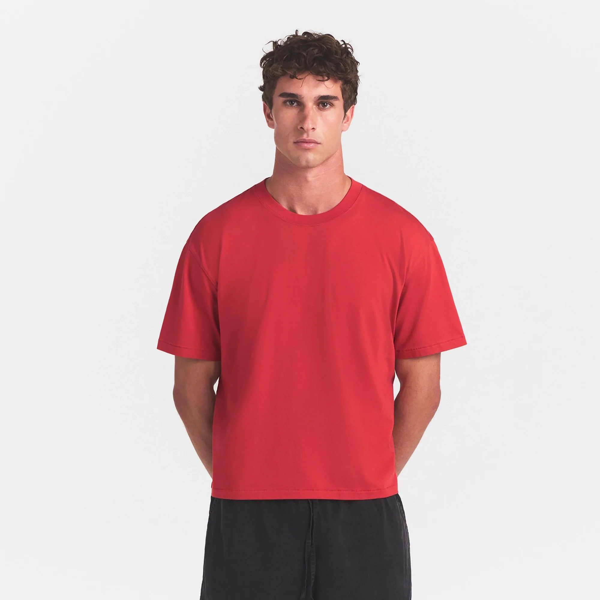 HEAVYWEIGHT COTTON MENS RELAXED CROPPED CREWNECK | WASHED RED ON A MODEL SIDE VIEW @ | FOCUS: 0.0, 1.0, 0.9