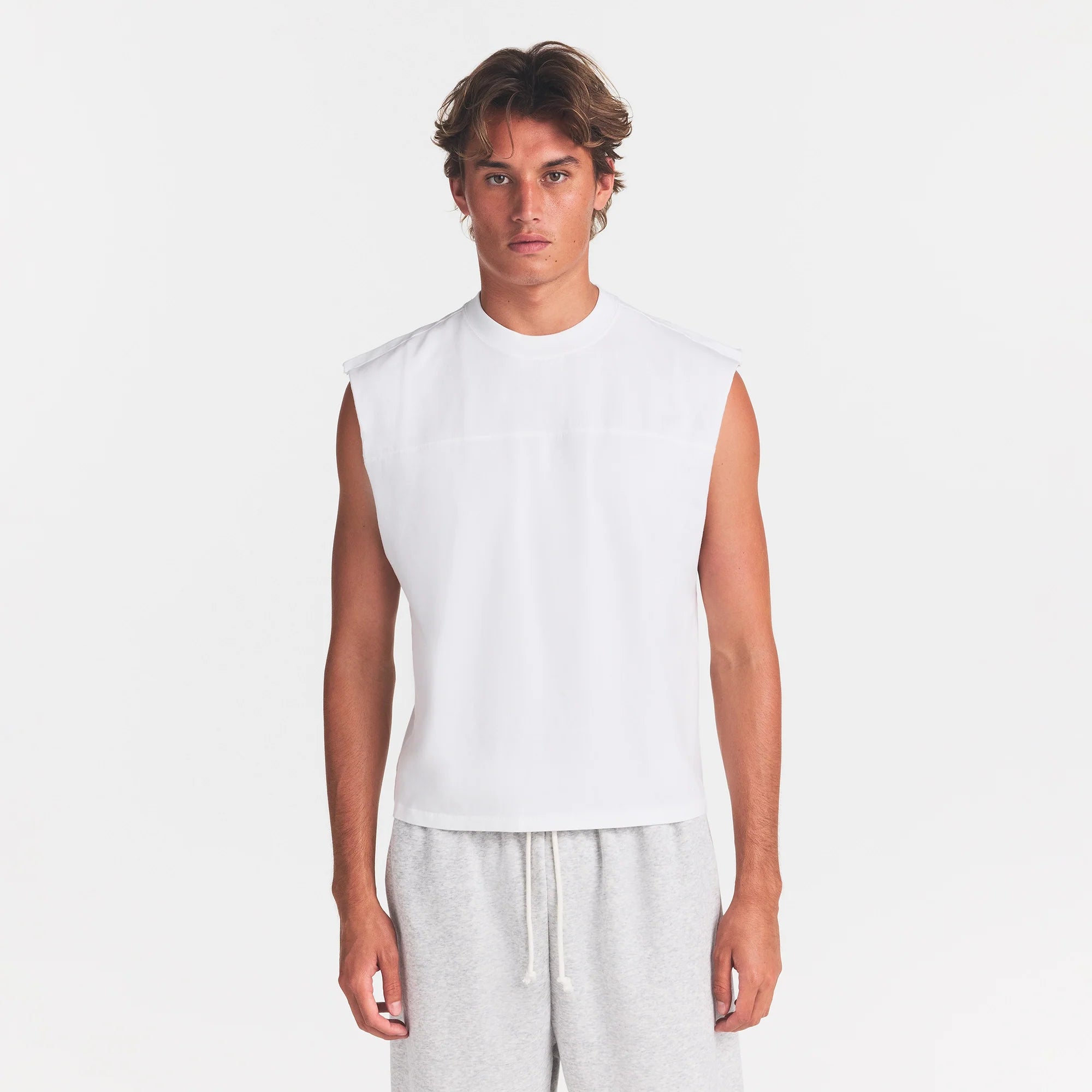 HEAVYWEIGHT COTTON MENS CROPPED MUSCLE TANK | CHALK ON A MODEL FRONT VIEW