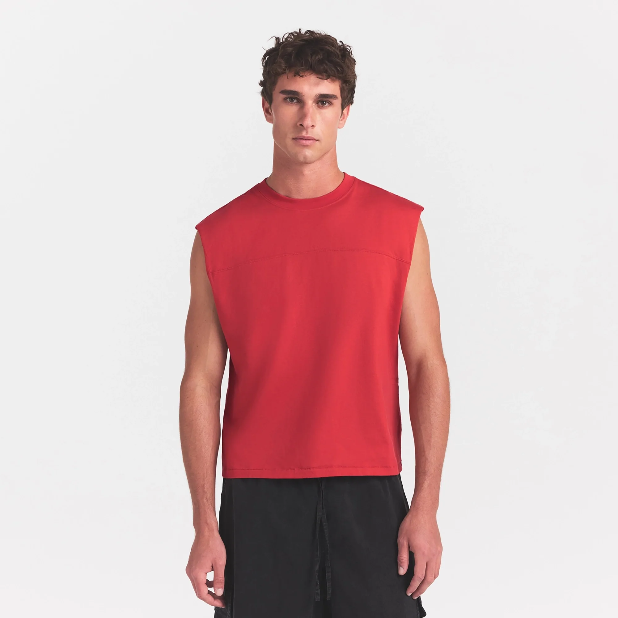 HEAVYWEIGHT COTTON MENS CROPPED MUSCLE TANK | WASHED RED ON A MODEL SIDE VIEW @ | FOCUS: 0.0, 1.0, 0.9