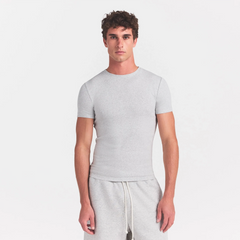 SKIMS COTTON RIB MENS T-SHIRT | LIGHT HEATHER GREY ON A MODEL SIDE VIEW @ | FOCUS: 0.0, 1.0, 0.9