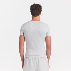 SKIMS COTTON RIB MENS T-SHIRT | LIGHT HEATHER GREY ON A MODEL SIDE VIEW @ | FOCUS: 0.0, 1.0, 0.9