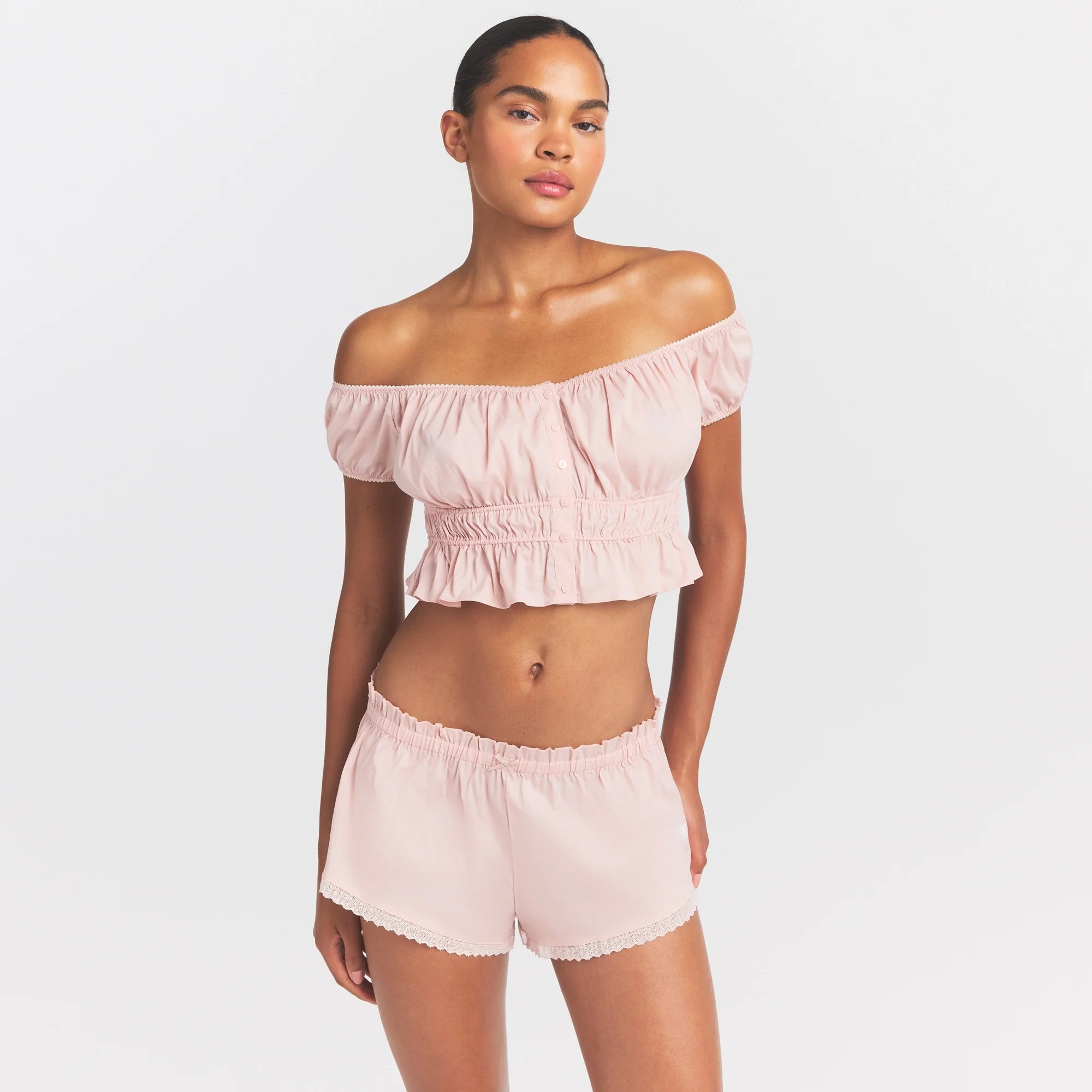 COTTON POPLIN OFF THE SHOULDER TOP | DUSTY PINK ON A MODEL SIDE VIEW @ | FOCUS: 0.0, 1.0, 0.9