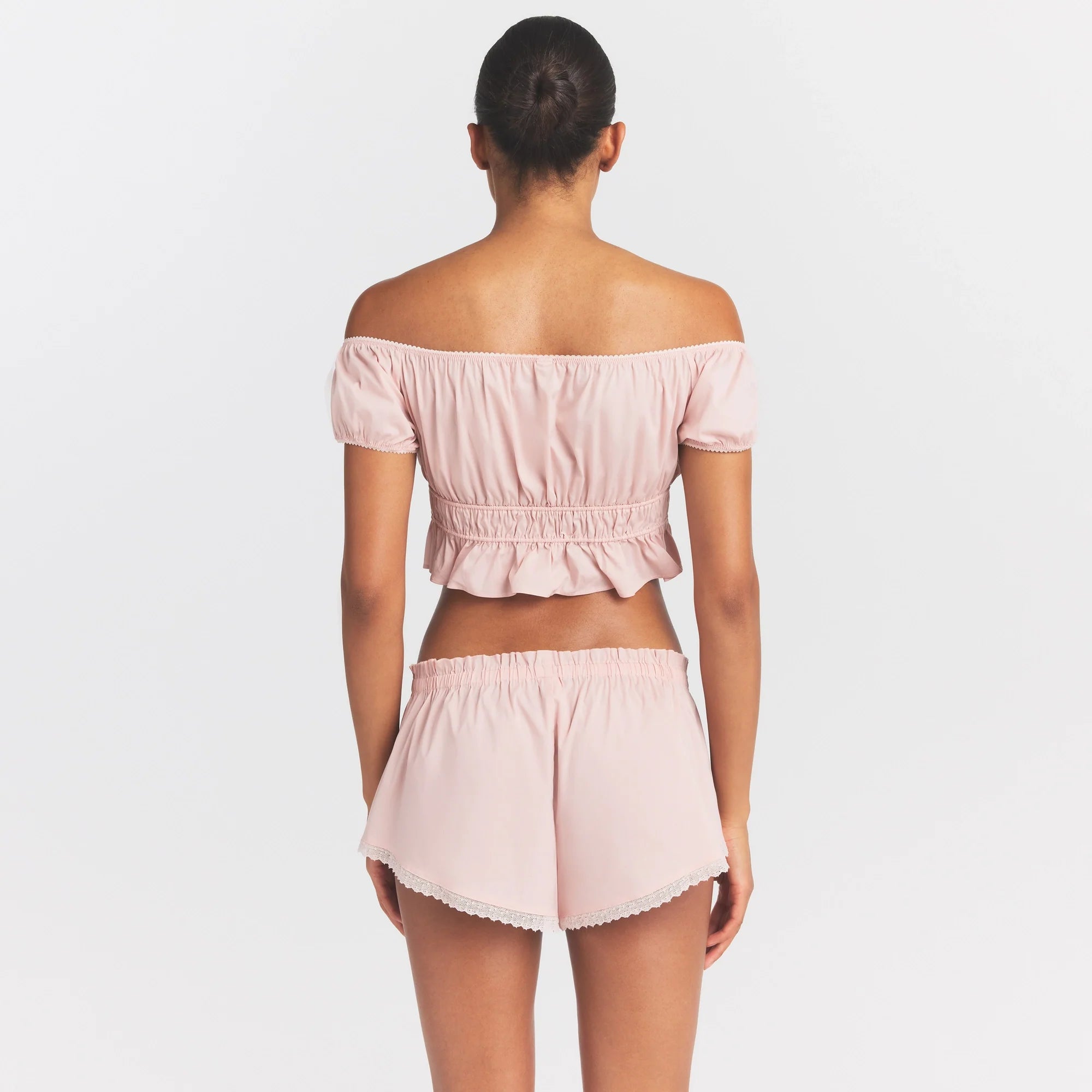 COTTON POPLIN OFF THE SHOULDER TOP | DUSTY PINK ON A MODEL SIDE VIEW @ | FOCUS: 0.0, 1.0, 0.9