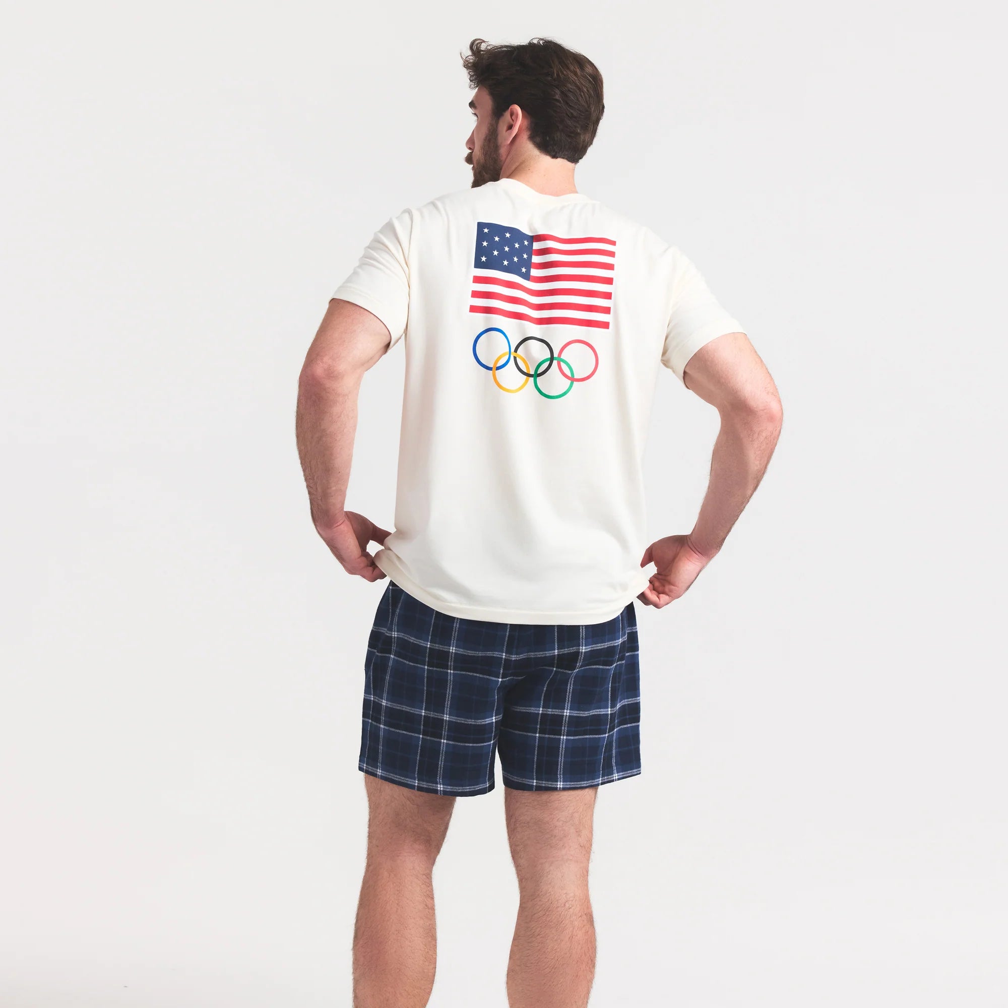SKIMS FOR TEAM USA JERSEY SLEEP MENS OLYMPIC T-SHIRT | ECRU ON A MODEL SIDE VIEW @ | FOCUS: 0.0, 1.0, 0.9