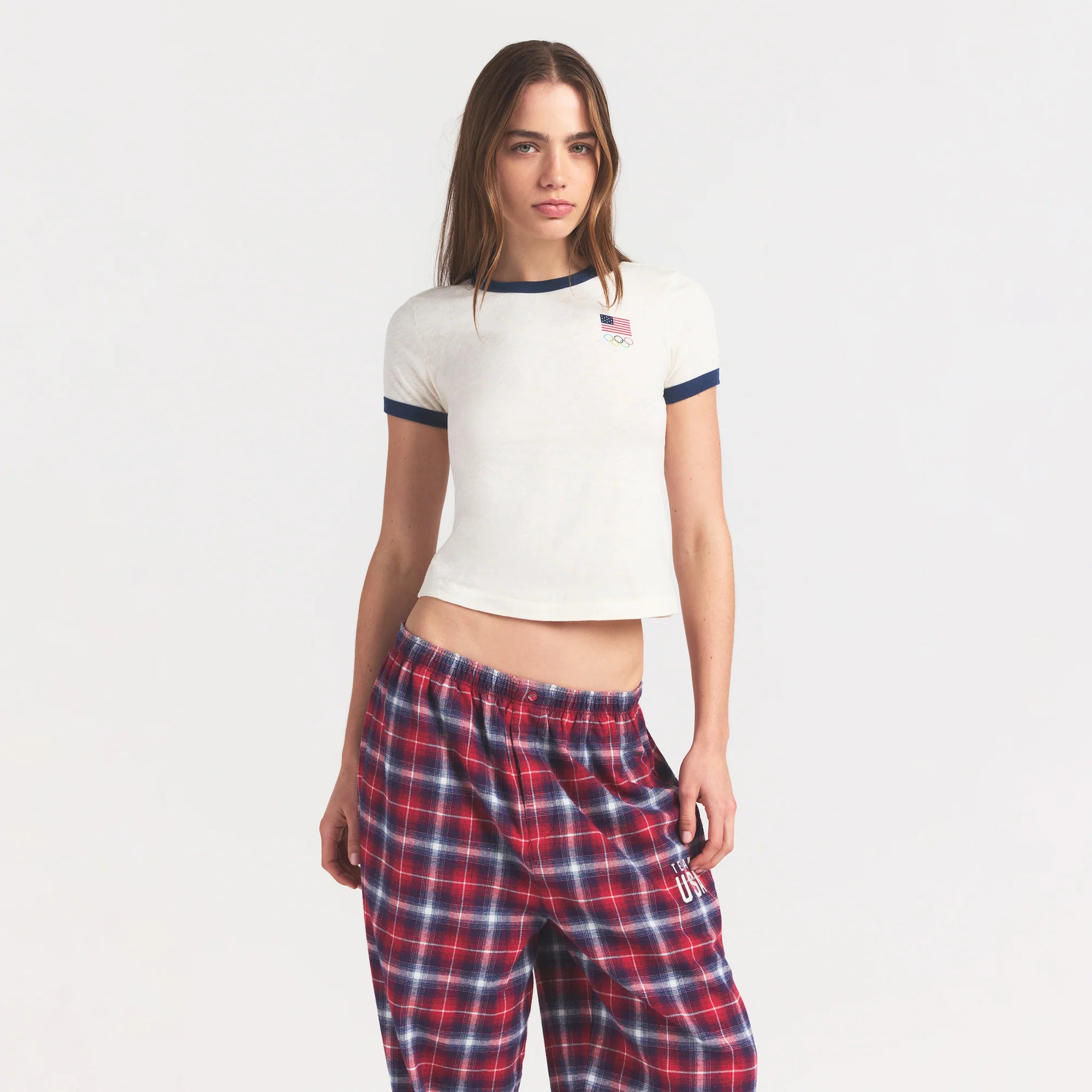 SKIMS FOR TEAM USA WORN IN JERSEY OLYMPIC SHRUNKEN T-SHIRT | ECRU ON A MODEL SIDE VIEW @ | FOCUS: 0.0, 1.0, 0.9