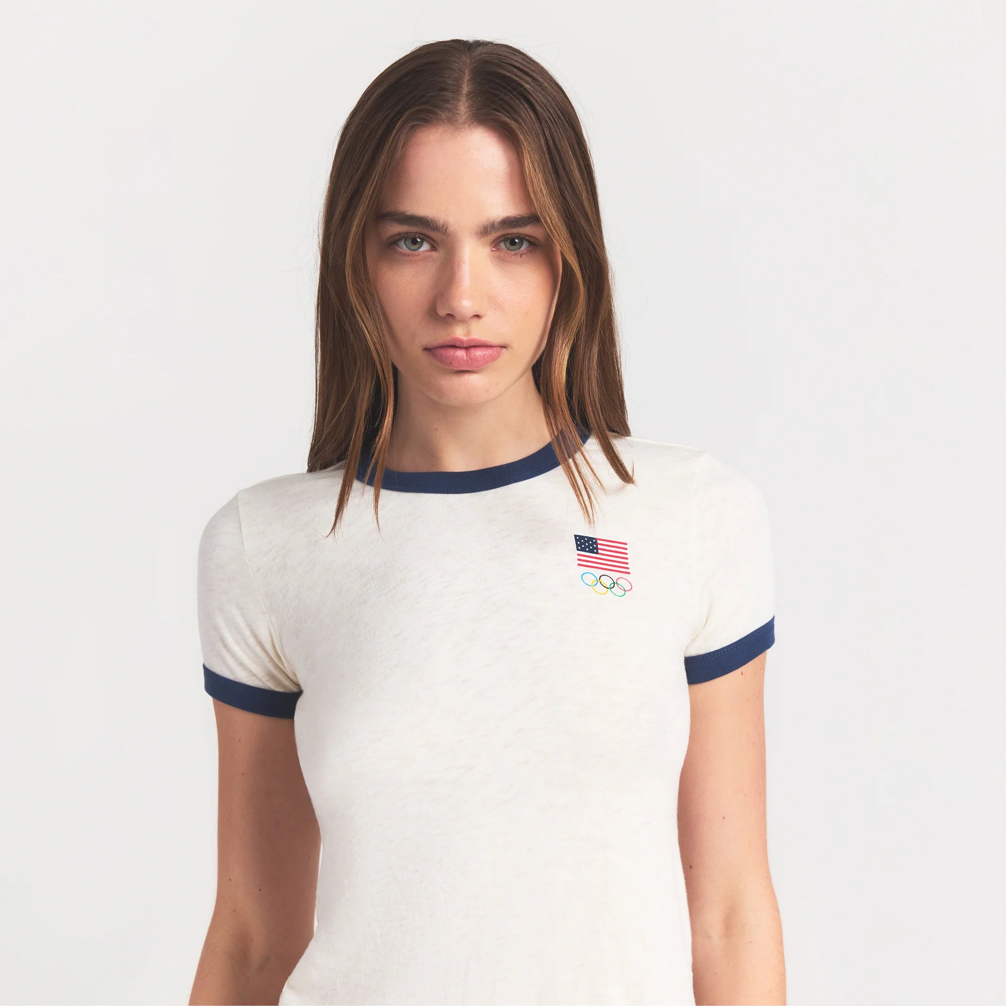 SKIMS FOR TEAM USA WORN IN JERSEY OLYMPIC SHRUNKEN T-SHIRT | ECRU ON A MODEL SIDE VIEW @ | FOCUS: 0.0, 1.0, 0.9