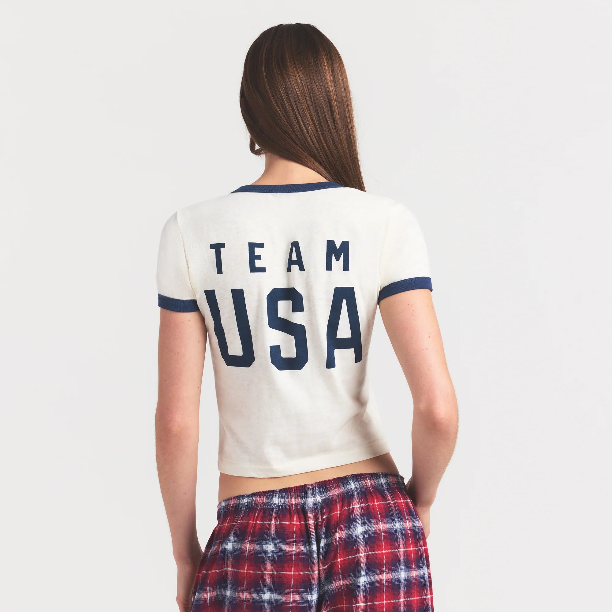 SKIMS FOR TEAM USA WORN IN JERSEY OLYMPIC SHRUNKEN T-SHIRT | ECRU ON A MODEL SIDE VIEW @ | FOCUS: 0.0, 1.0, 0.9