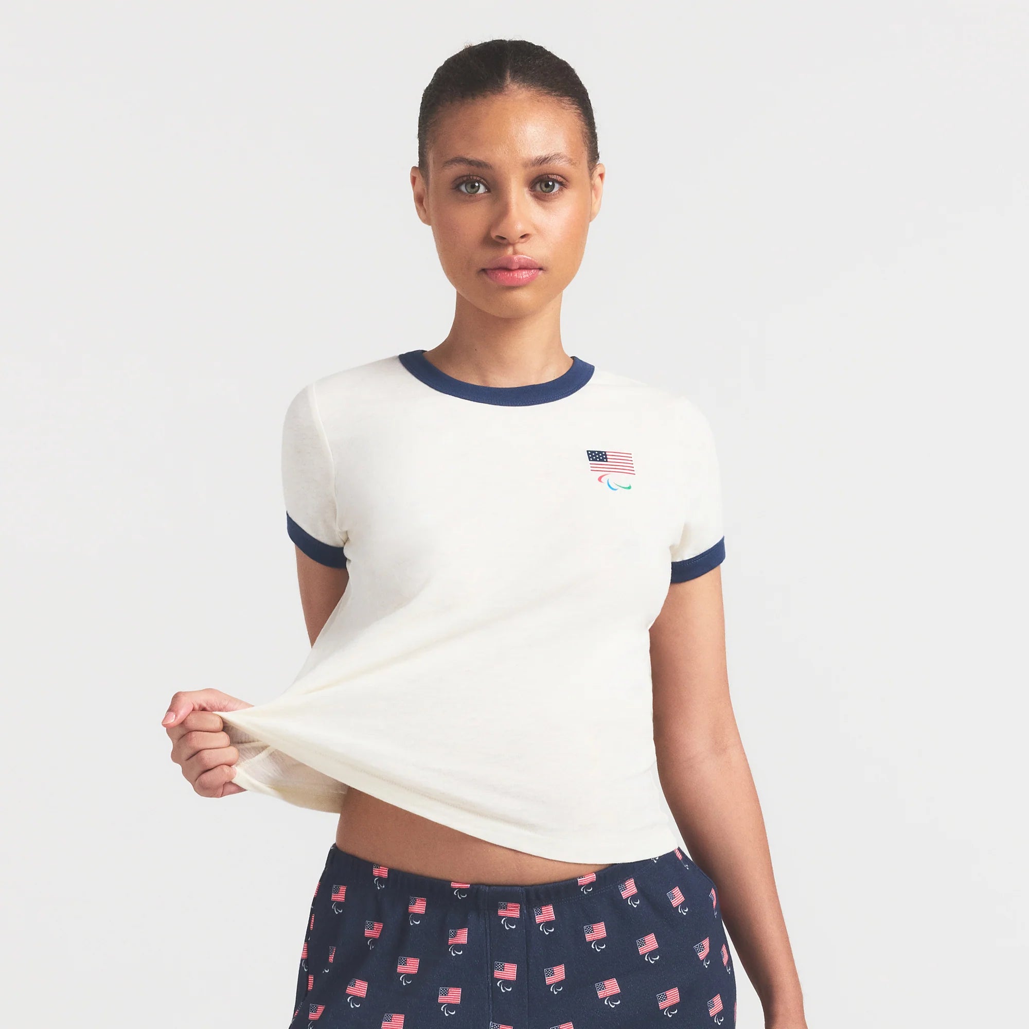 SKIMS FOR TEAM USA WORN IN JERSEY PARALYMPIC SHRUNKEN T-SHIRT | ECRU ON A MODEL SIDE VIEW @ | FOCUS: 0.0, 1.0, 0.9