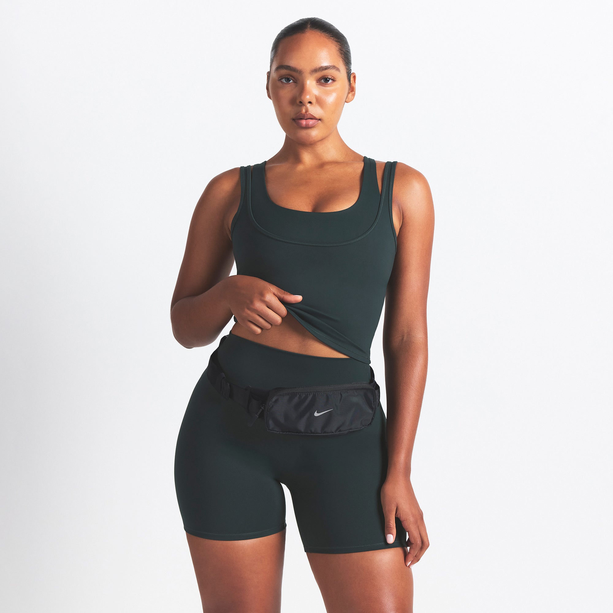 NikeSKIMS MATTE DOUBLE STRAP SCOOP TANK | DARK TEAL ON A MODEL SIDE VIEW @ | FOCUS: 0.0, 1.0, 0.9