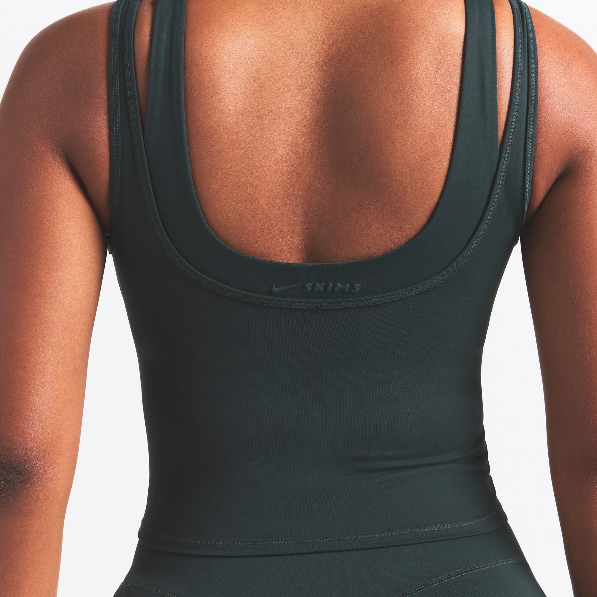 NikeSKIMS MATTE DOUBLE STRAP SCOOP TANK | DARK TEAL ON A MODEL SIDE VIEW @ | FOCUS: 0.0, 1.0, 0.9