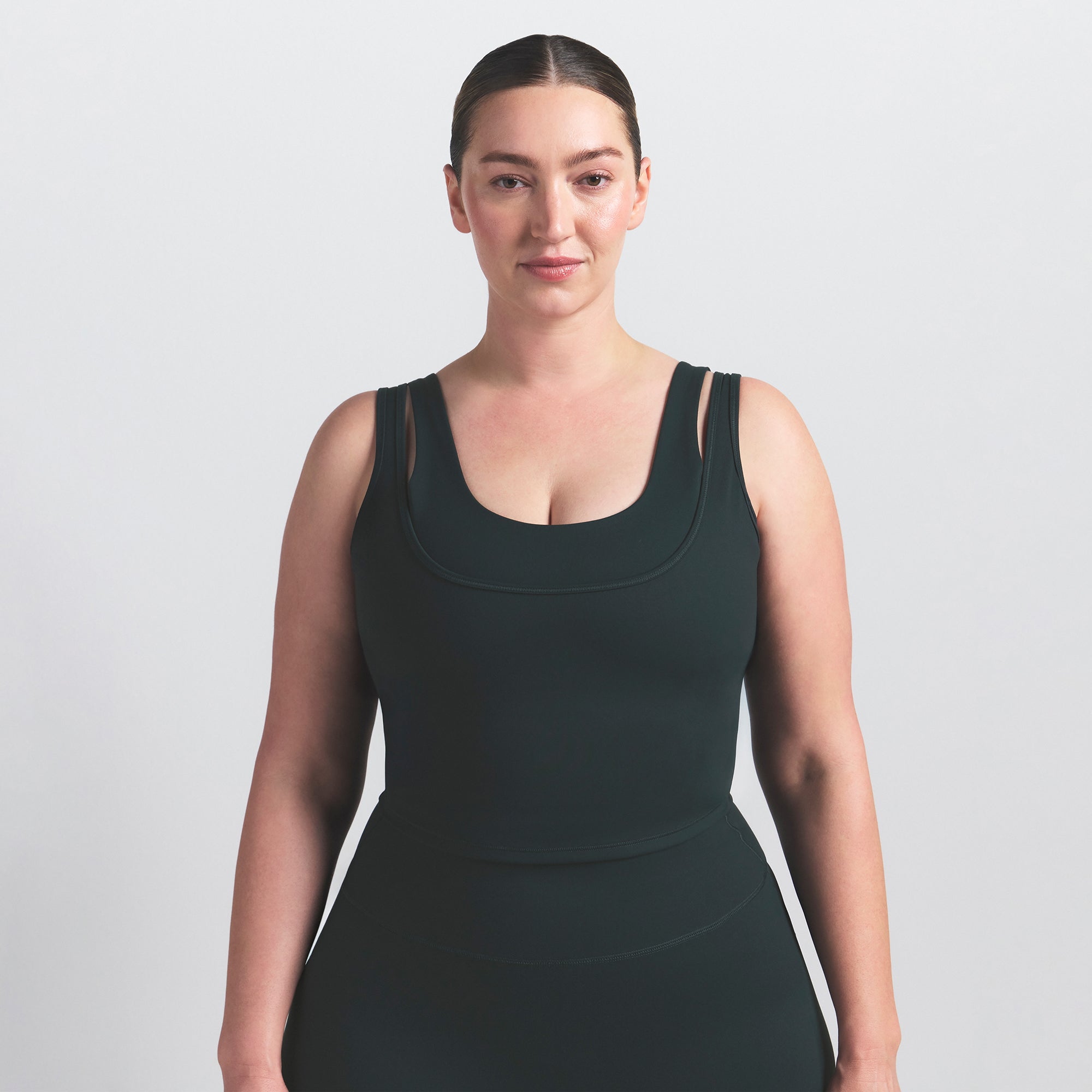 NikeSKIMS MATTE DOUBLE STRAP SCOOP TANK | DARK TEAL ON A MODEL SIDE VIEW @ | FOCUS: 0.0, 1.0, 0.9