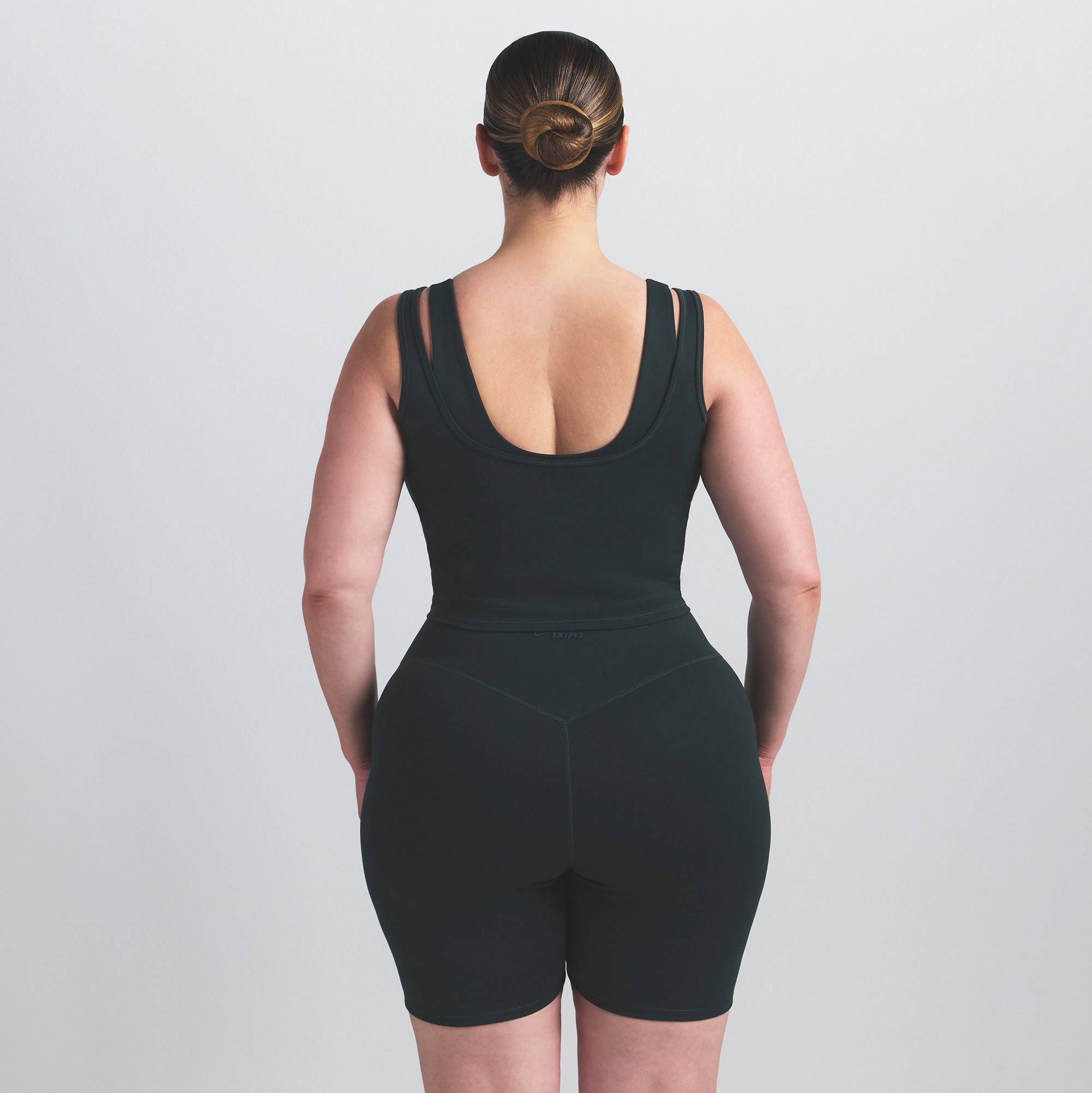 NikeSKIMS MATTE DOUBLE STRAP SCOOP TANK | DARK TEAL ON A MODEL SIDE VIEW @ | FOCUS: 0.0, 1.0, 0.9