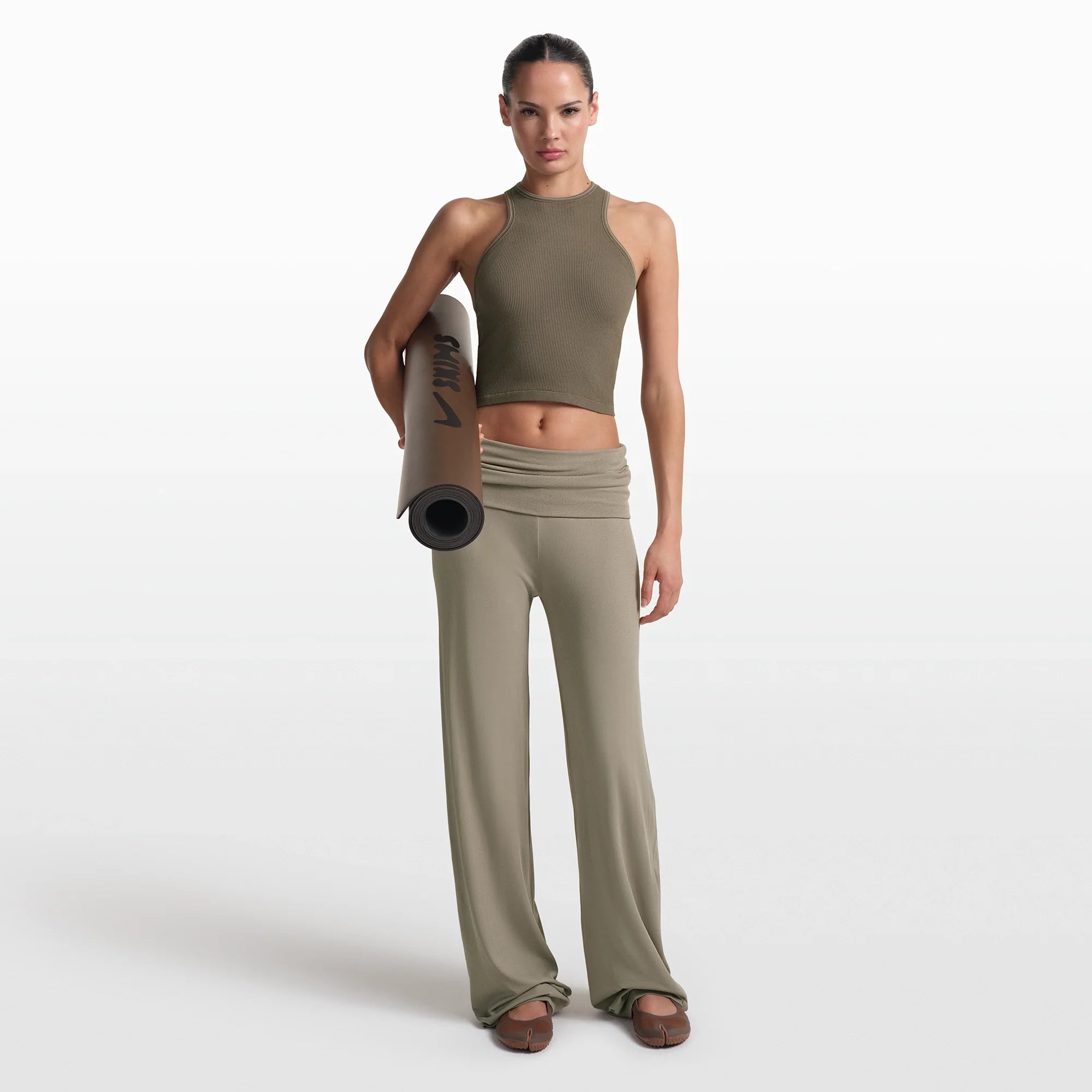 NikeSKIMS RIBBED SEAMLESS RACER FRONT TANK | DUSTY OAKMOSS/DUNE ON A MODEL FRONT VIEW @ | FOCUS: 0.0, 1.0, 0.9