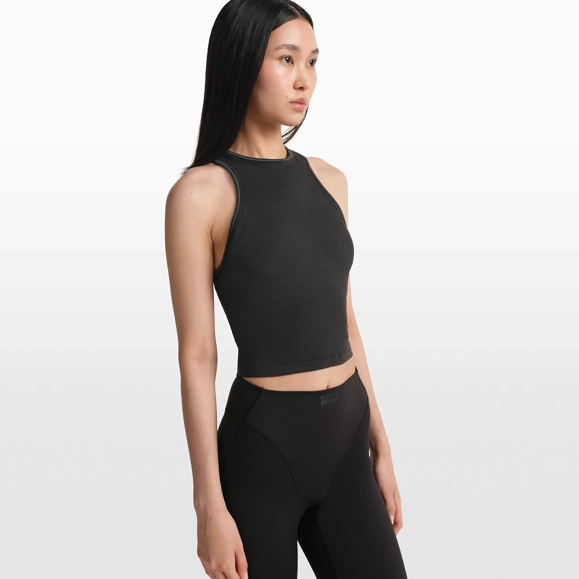 NikeSKIMS RIBBED SEAMLESS RACER FRONT TANK | OBSIDIAN/ARMOR ON A MODEL FRONT VIEW @ | FOCUS: 0.0, 1.0, 0.9