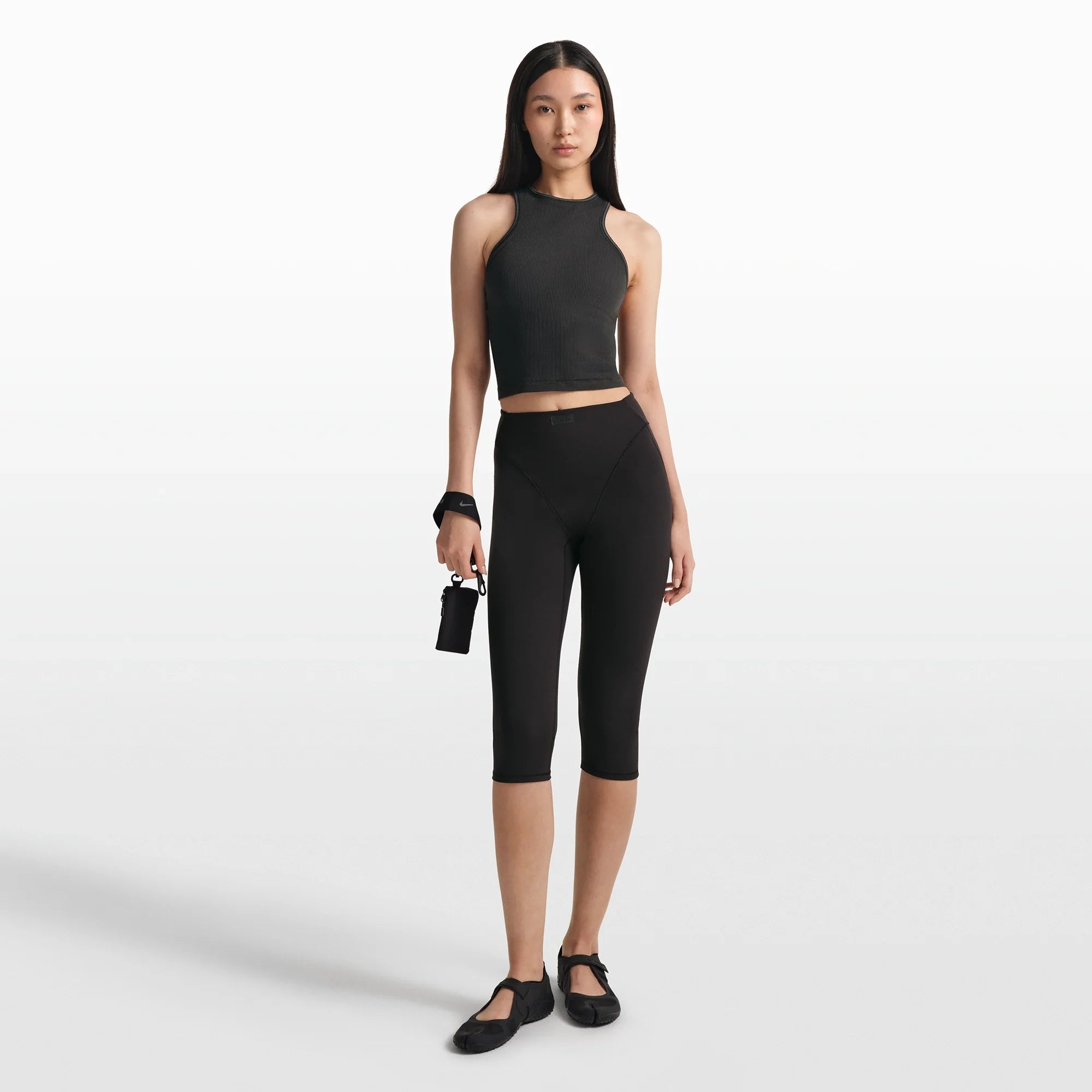 NikeSKIMS RIBBED SEAMLESS RACER FRONT TANK | OBSIDIAN/ARMOR ON A MODEL FRONT VIEW @ | FOCUS: 0.0, 1.0, 0.9