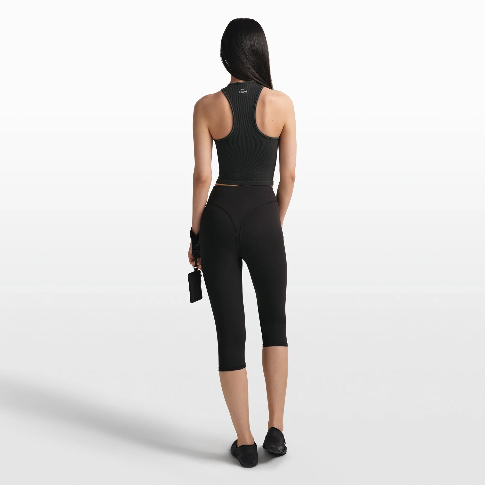 NikeSKIMS RIBBED SEAMLESS RACER FRONT TANK | OBSIDIAN/ARMOR ON A MODEL FRONT VIEW @ | FOCUS: 0.0, 1.0, 0.9