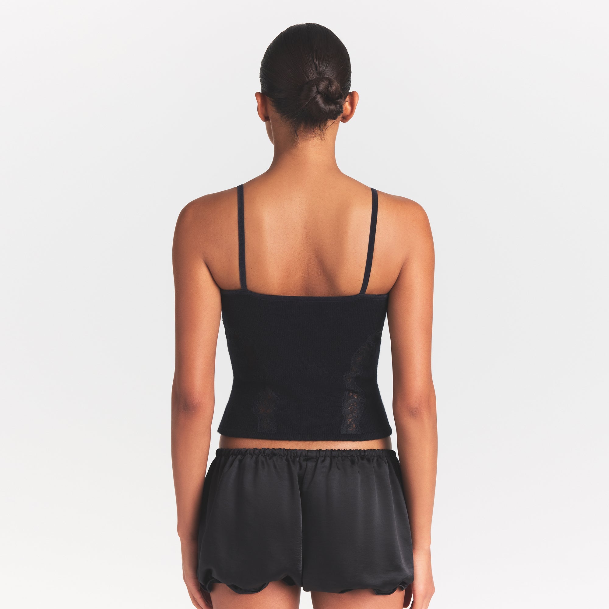 LACE KNIT TANK | OBSIDIAN ON A MODEL SIDE VIEW @ | FOCUS: 0.0, 1.0, 0.9