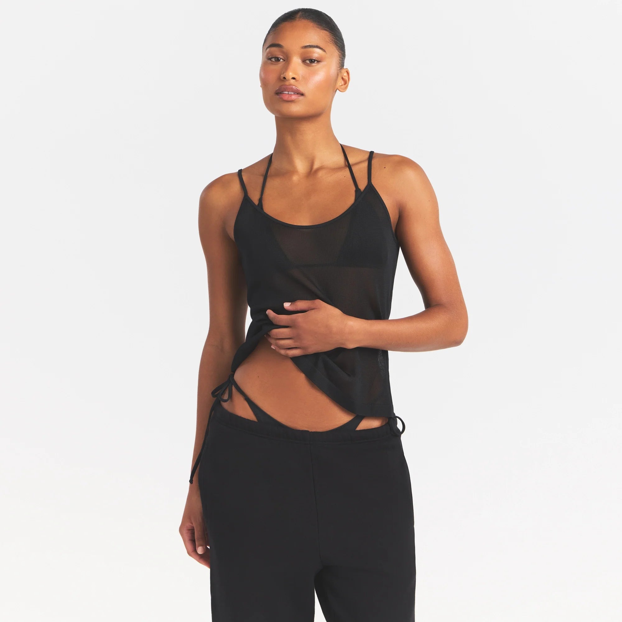 SLINKY KNIT CAMI | OBSIDIAN ON A MODEL SIDE VIEW @ | FOCUS: 0.0, 1.0, 0.9