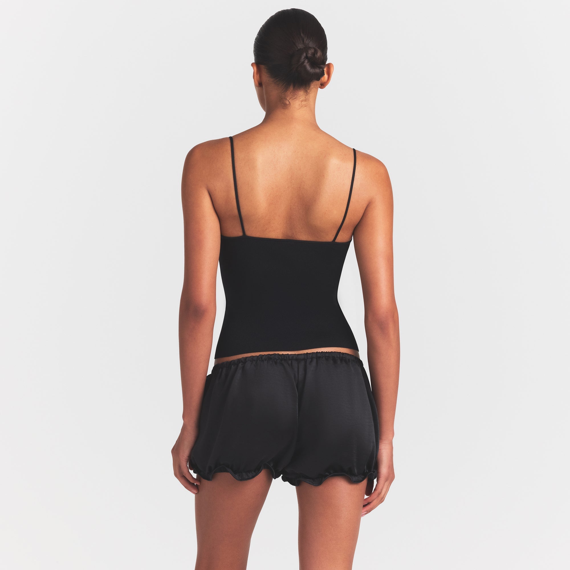 REFINED KNIT CAMI | OBSIDIAN ON A MODEL SIDE VIEW @ | FOCUS: 0.0, 1.0, 0.9