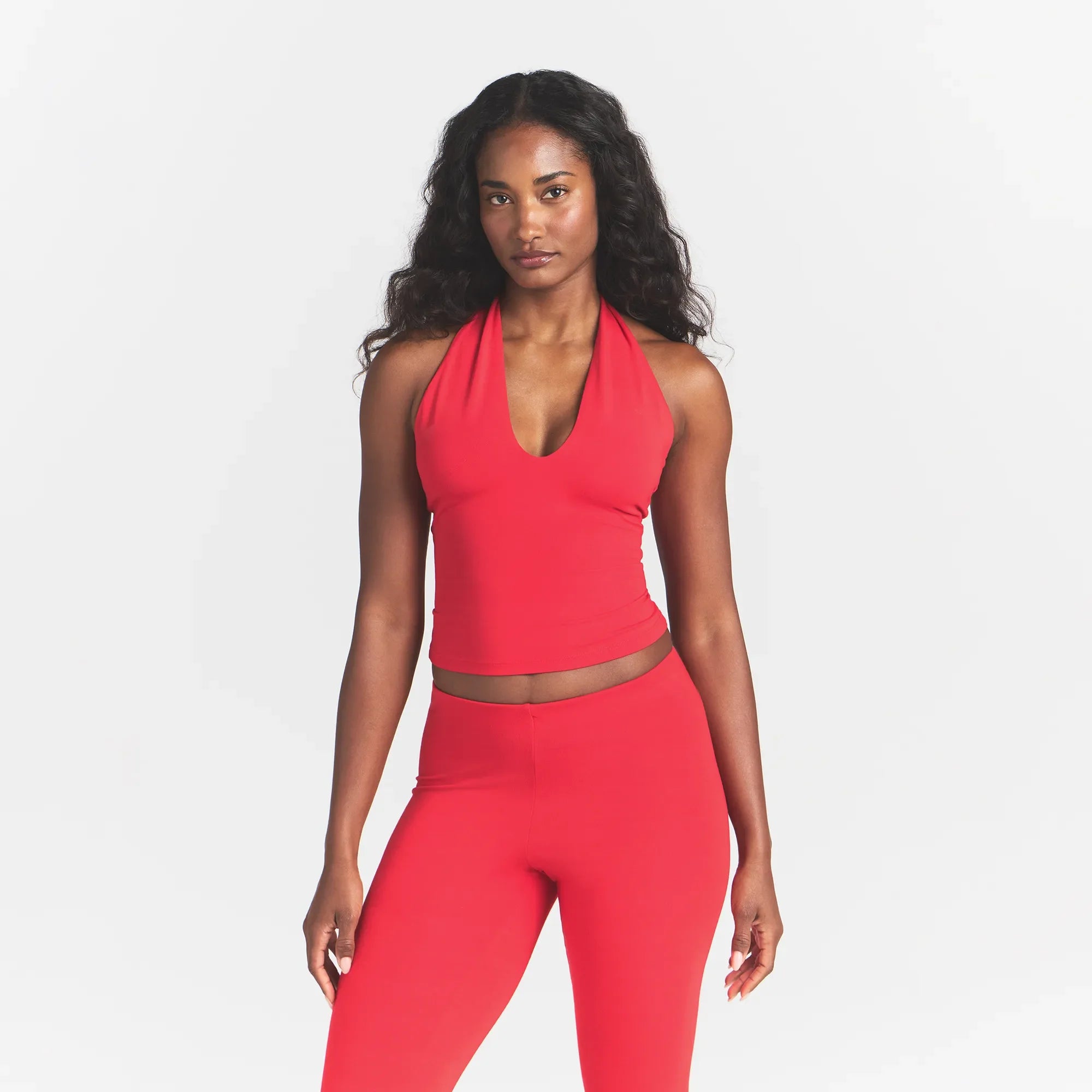 SMOOTH LAYERS HALTER TOP | CARMINE ON A MODEL FRONT VIEW @ | FOCUS: 0.0, 1.0, 0.9
