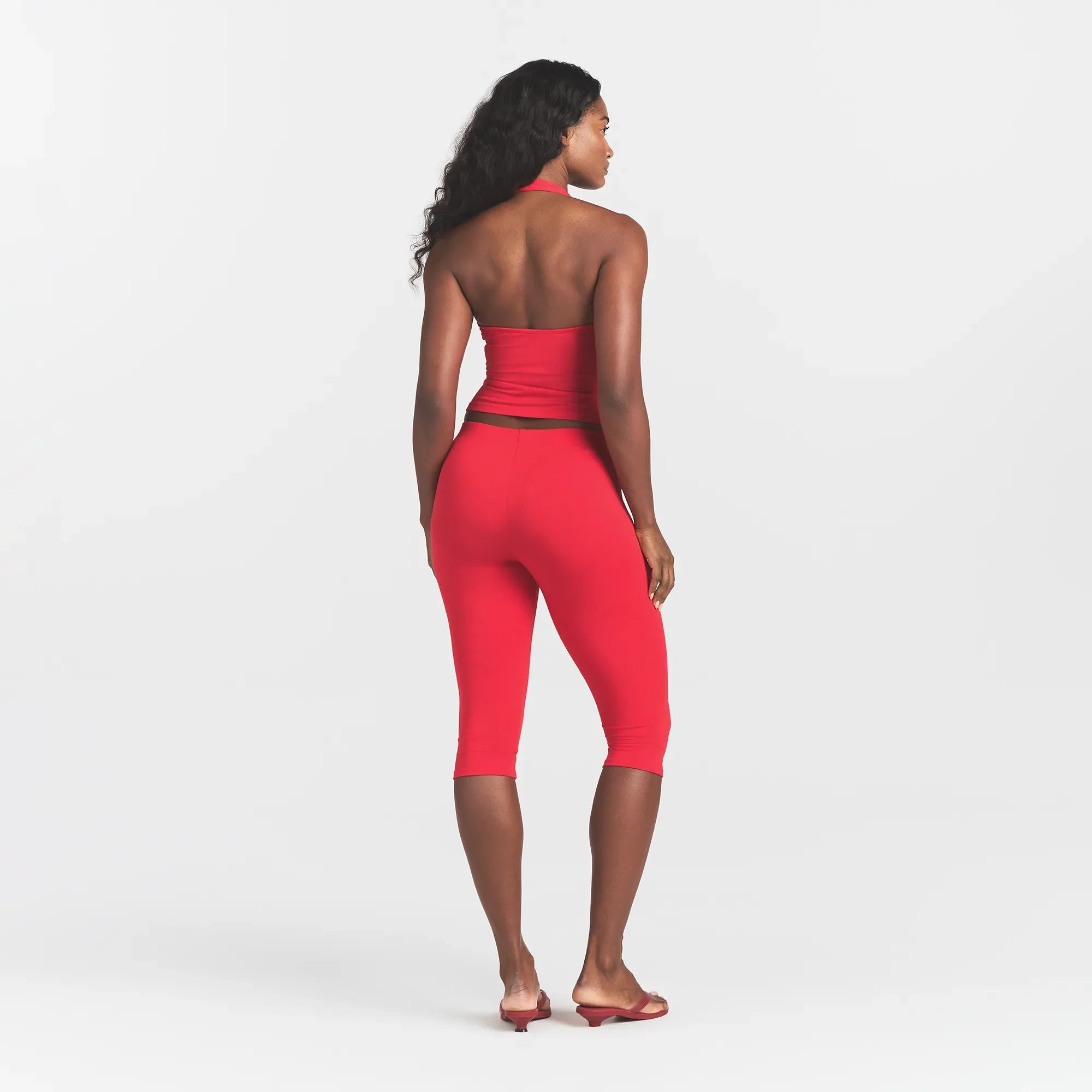 SMOOTH LAYERS HALTER TOP | CARMINE ON A MODEL BACK VIEW @ | FOCUS: 0.0, 1.0, 0.9