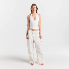 SMOOTH LAYERS HALTER TOP | EGRET ON A MODEL FRONT VIEW @ | FOCUS: 0.0, 1.0, 0.9