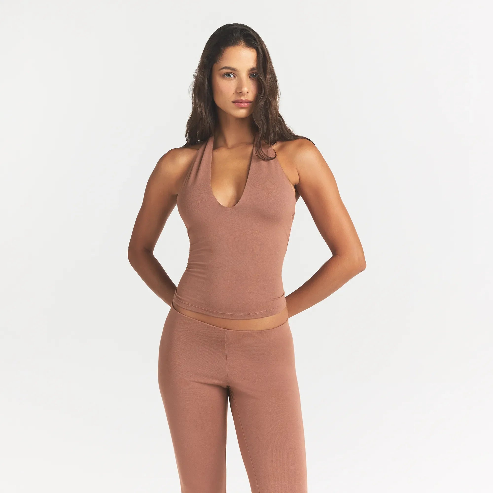 SMOOTH LAYERS HALTER TOP | NUTMEG ON A MODEL FRONT VIEW @ | FOCUS: 0.0, 1.0, 0.9